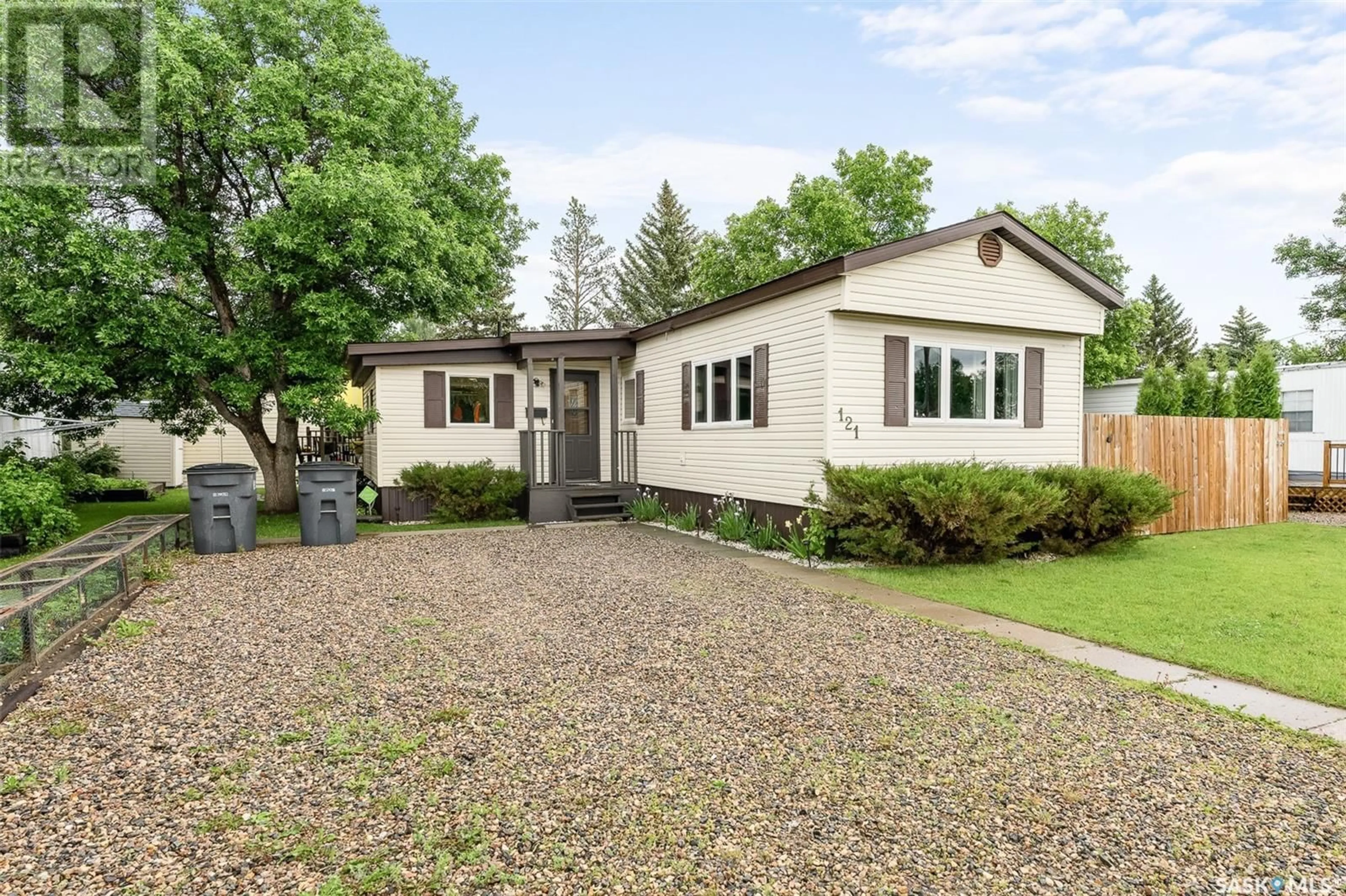 Home with vinyl exterior material, street for 121 LARCH STREET, Caronport Saskatchewan S0H0S0