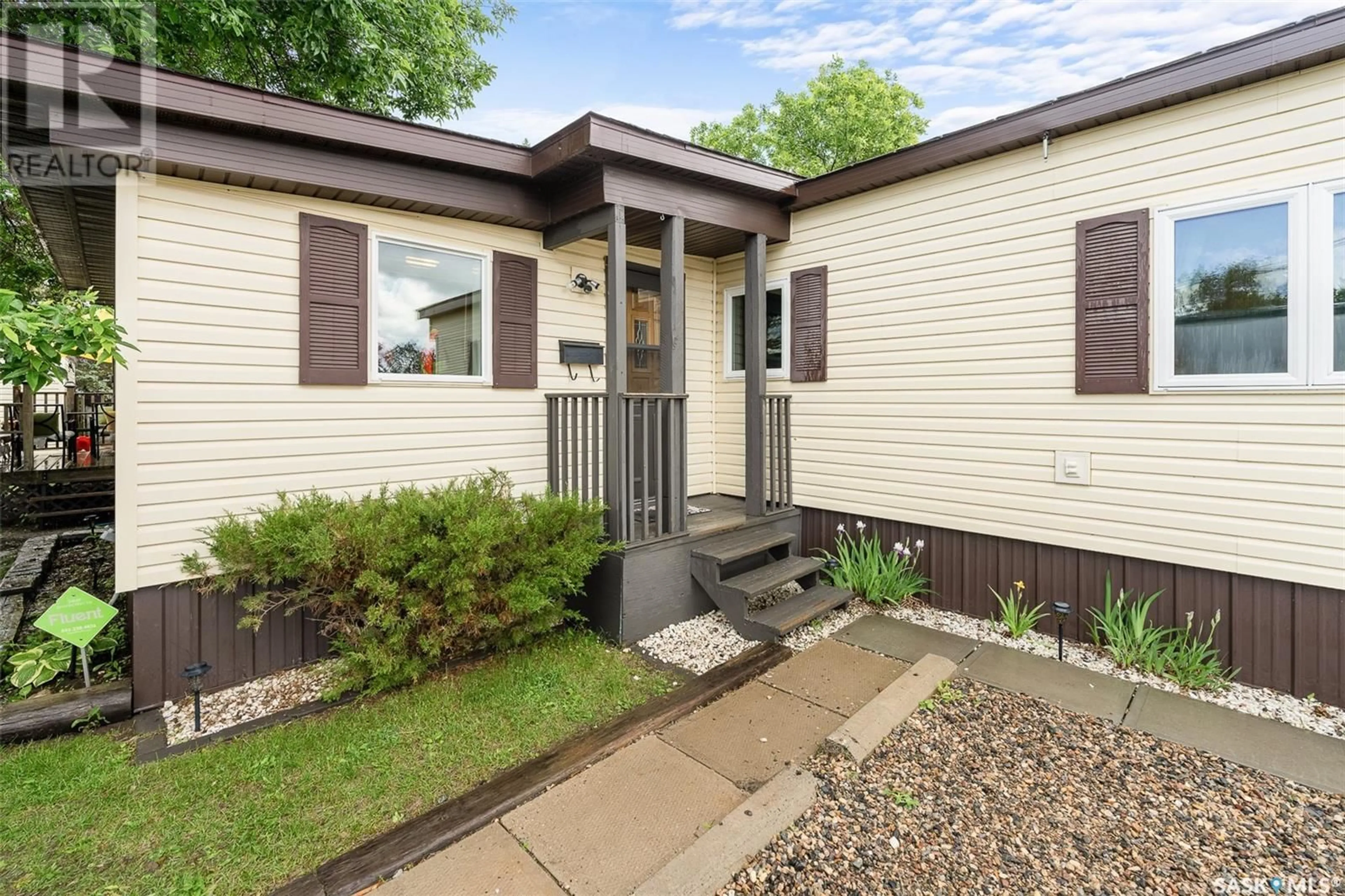 Home with vinyl exterior material, street for 121 LARCH STREET, Caronport Saskatchewan S0H0S0