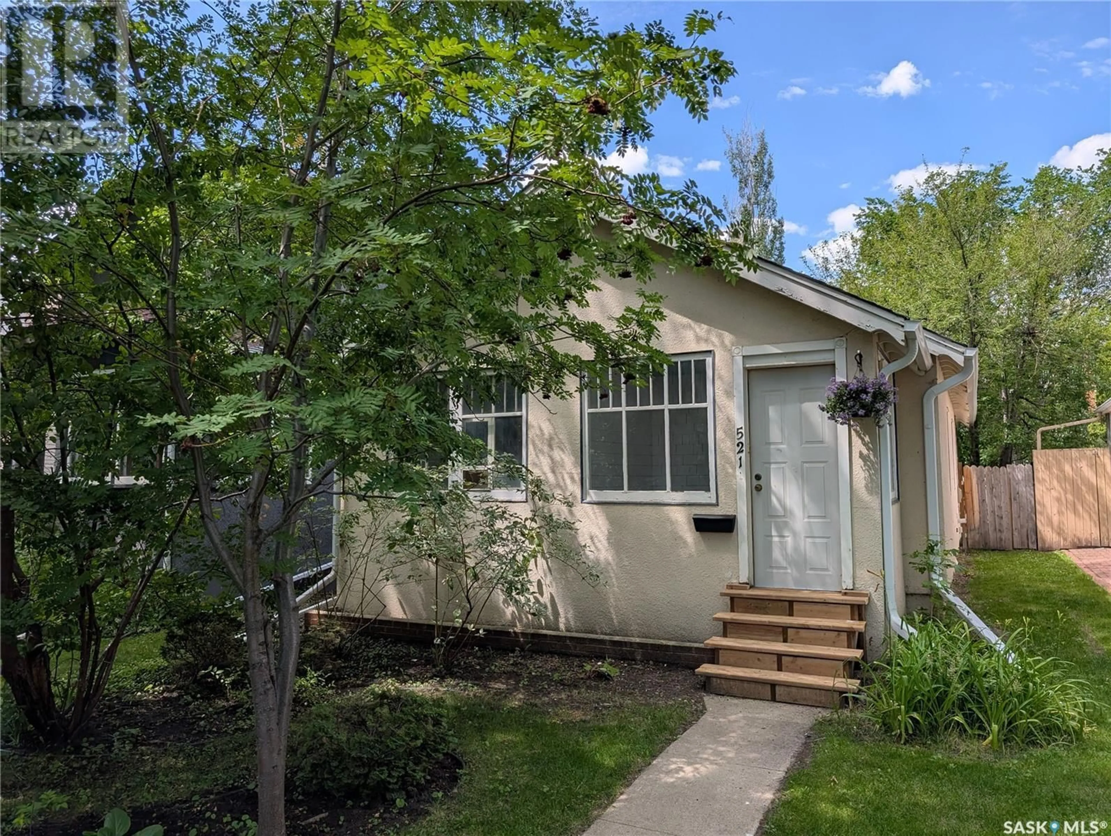 Home with vinyl exterior material, street for 521 4TH AVENUE, Saskatoon Saskatchewan S7K2M5