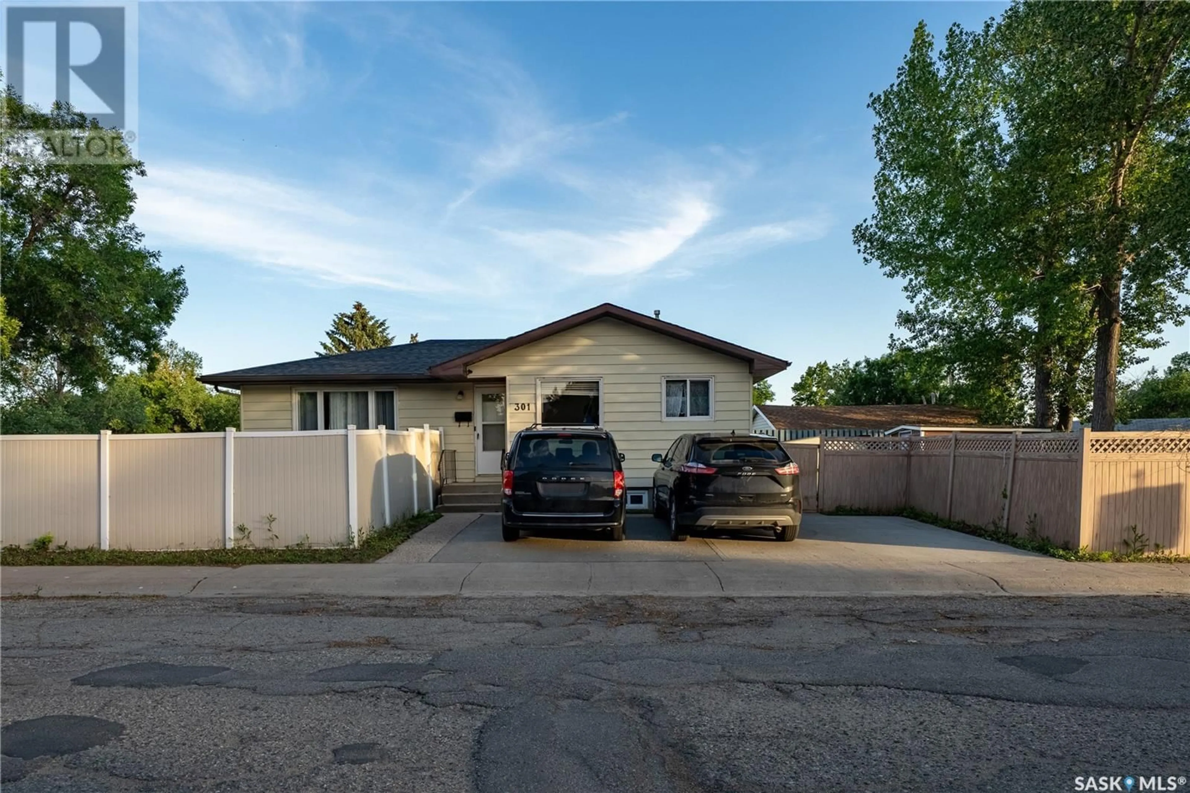 A pic from outside/outdoor area/front of a property/back of a property/a pic from drone, street for 301 MIKKELSON DRIVE, Regina Saskatchewan S4T6E1