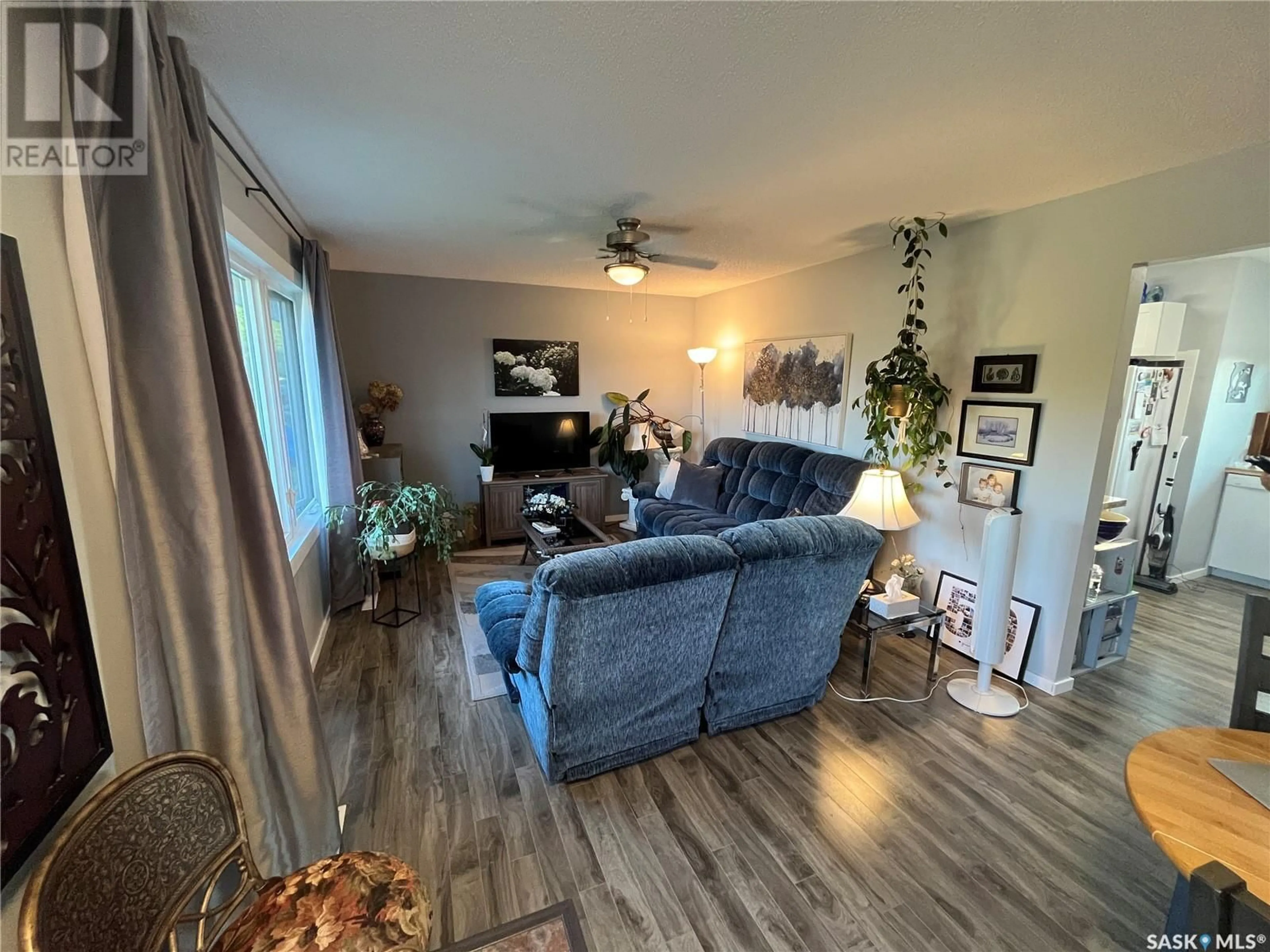 Living room with furniture, wood/laminate floor for 310 MAIN STREET, Abernethy Saskatchewan S0A0V0