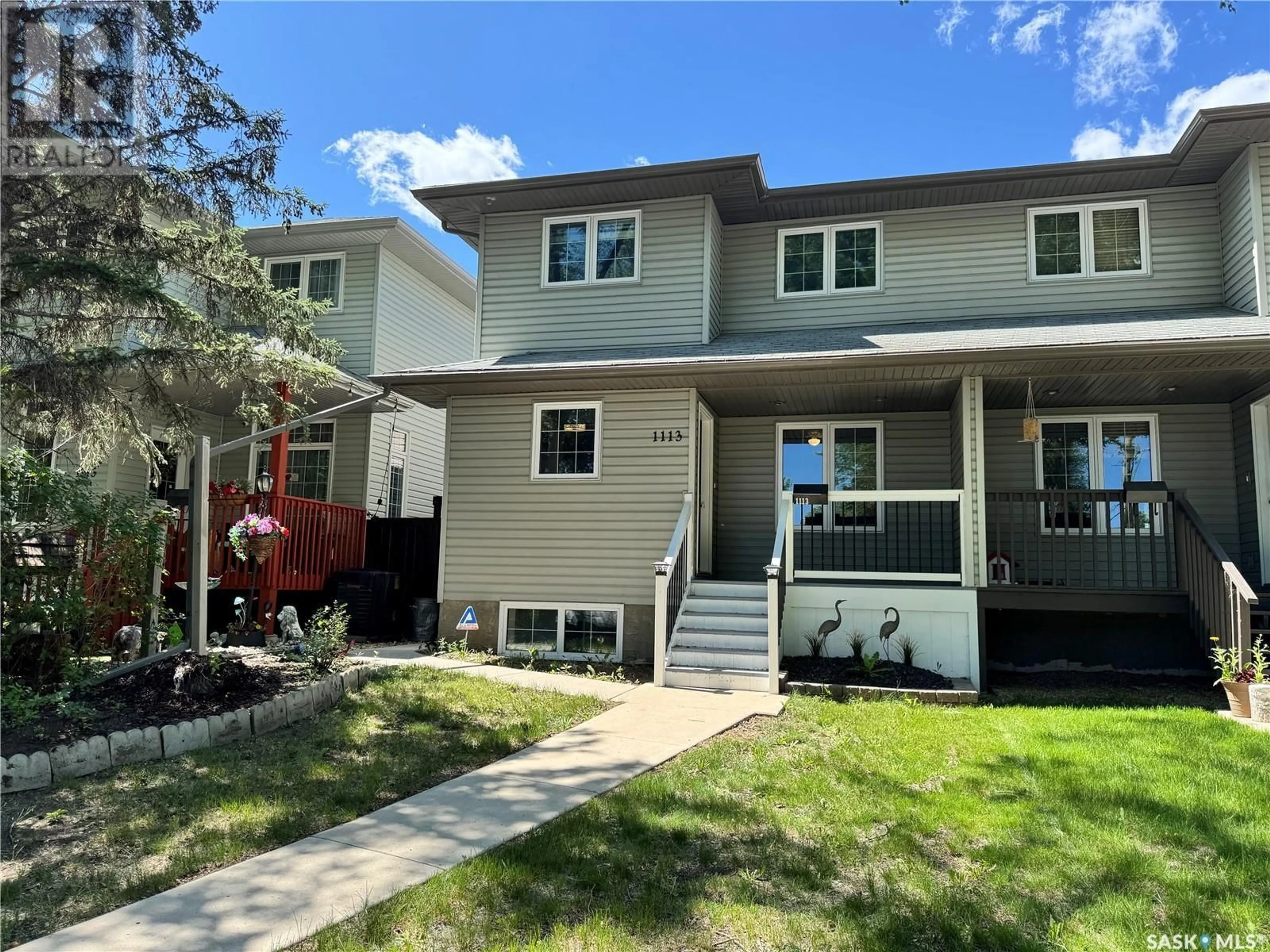 Home with vinyl exterior material, street for 1113 J AVENUE, Saskatoon Saskatchewan S7M2C2