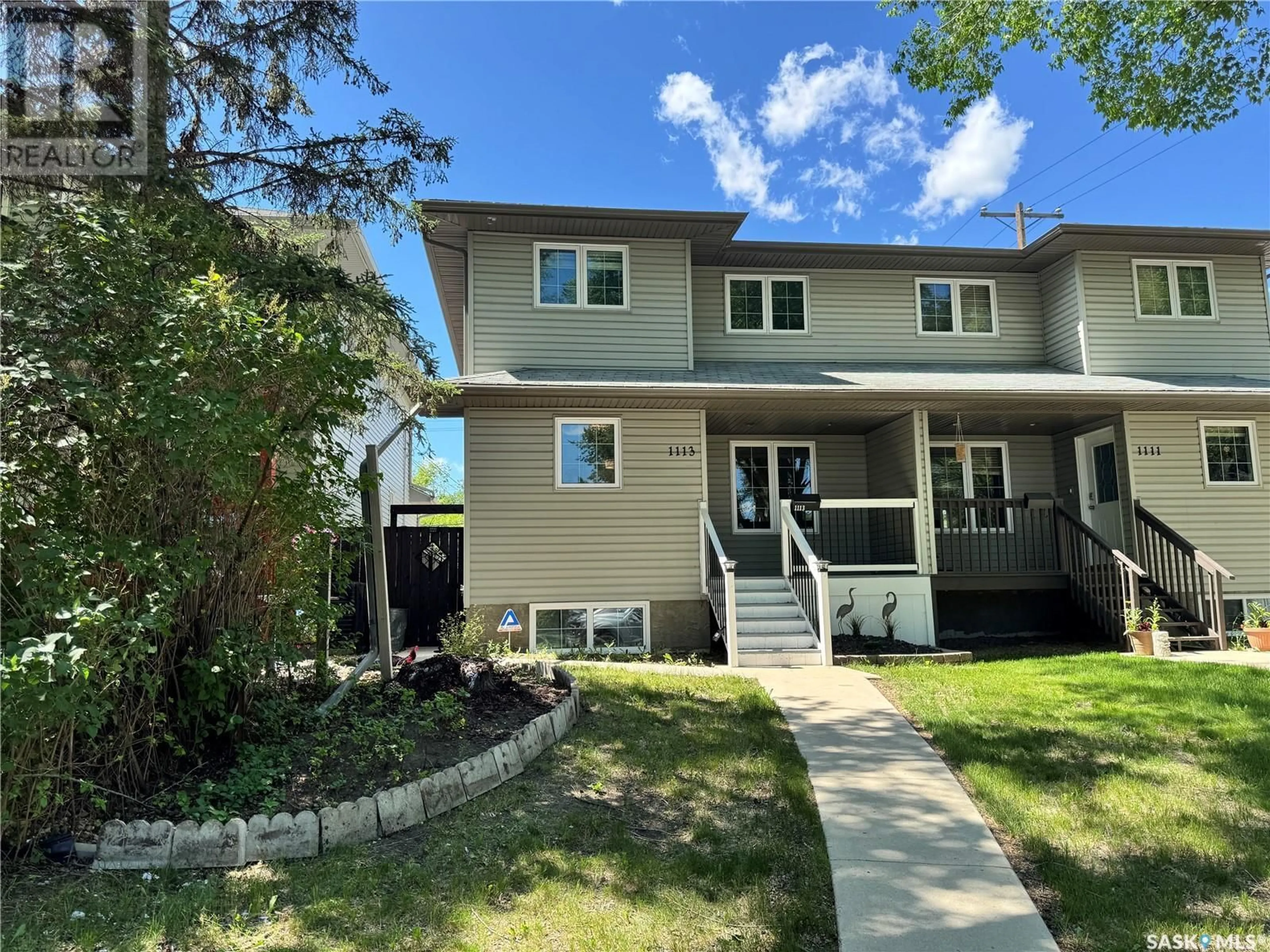 Home with vinyl exterior material, street for 1113 J AVENUE, Saskatoon Saskatchewan S7M2C2