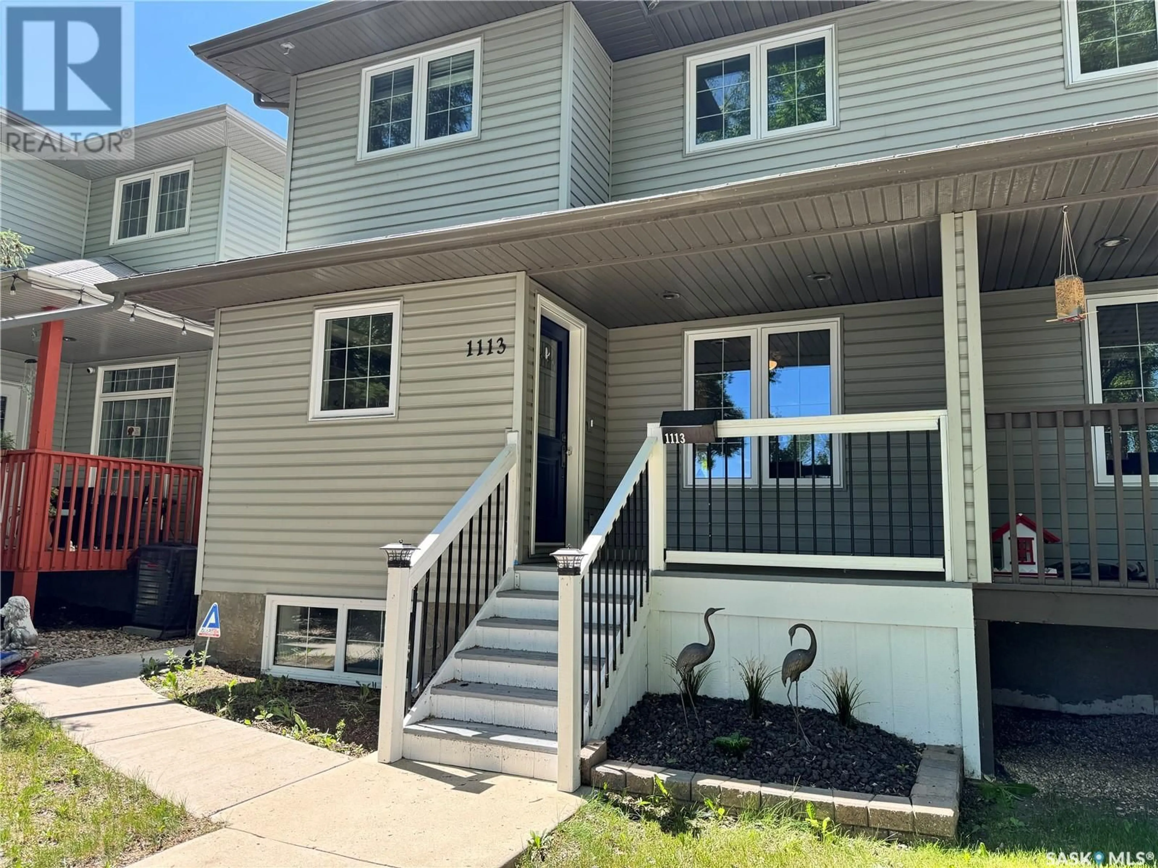 Home with vinyl exterior material, street for 1113 J AVENUE, Saskatoon Saskatchewan S7M2C2