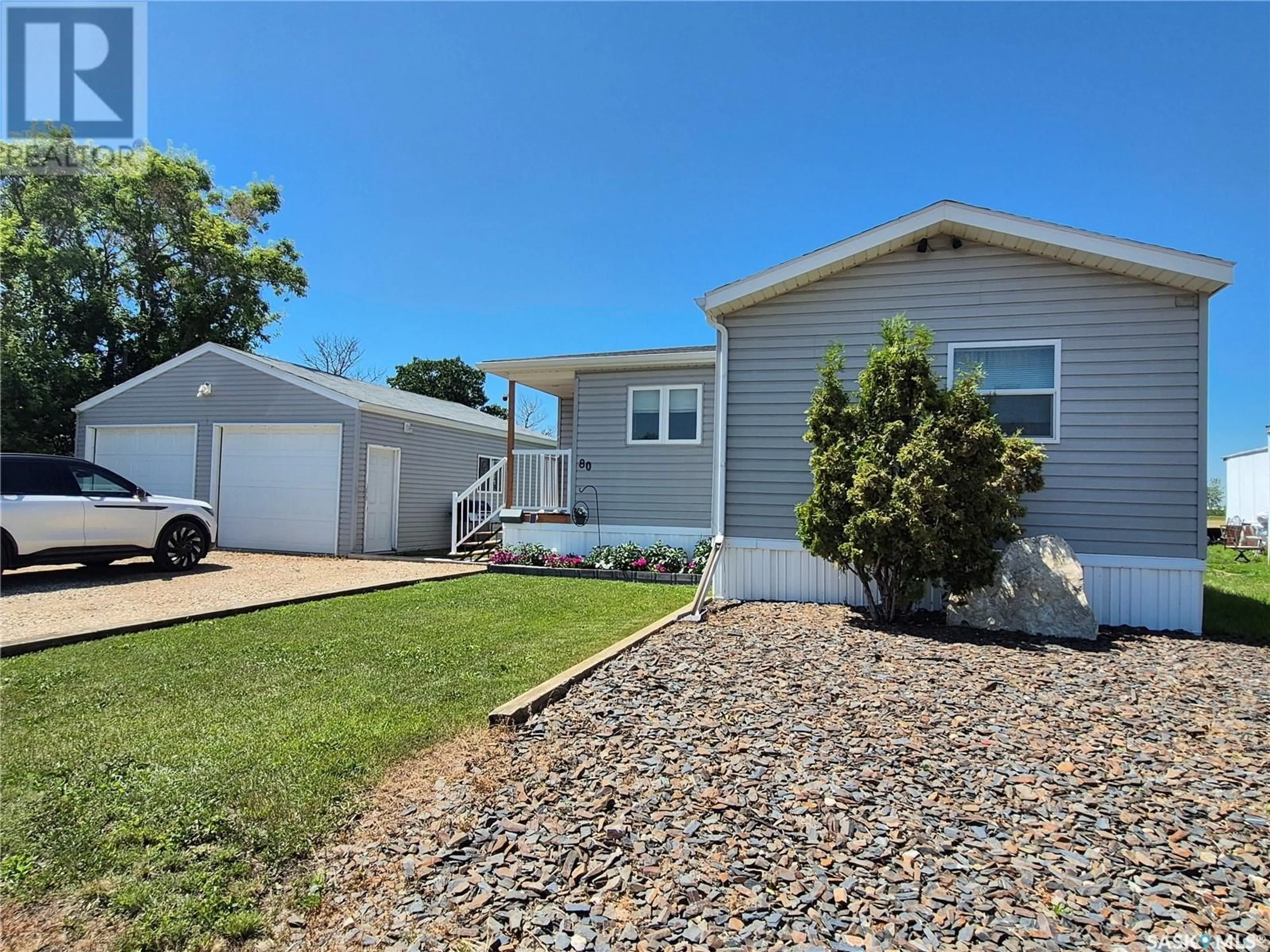 Home with vinyl exterior material, street for SW - 80-81 106 1ST AVENUE, Weyburn Saskatchewan S4H2J1