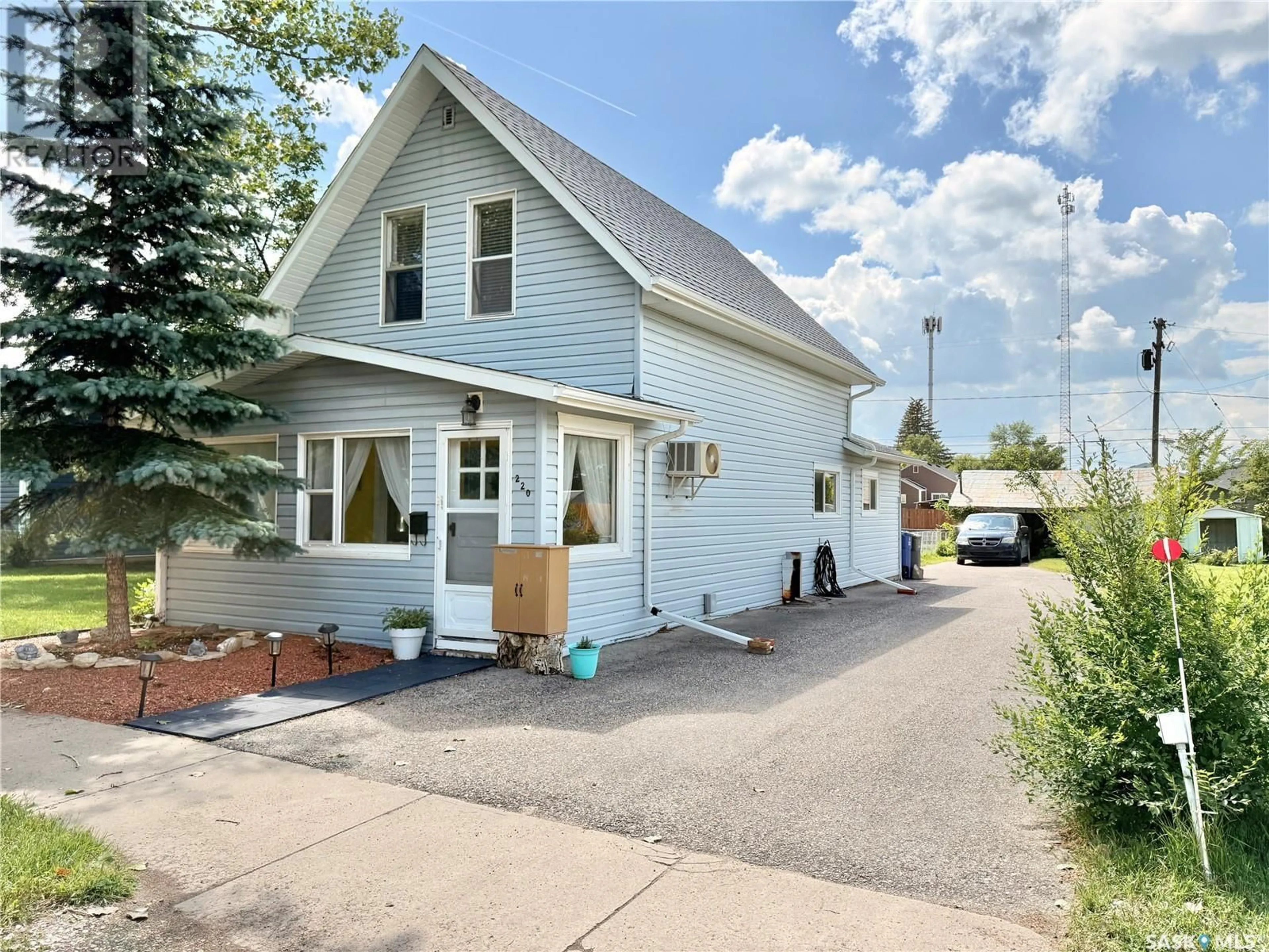 Home with vinyl exterior material, street for 220 DOUGLASS STREET, Outlook Saskatchewan S0L2N0