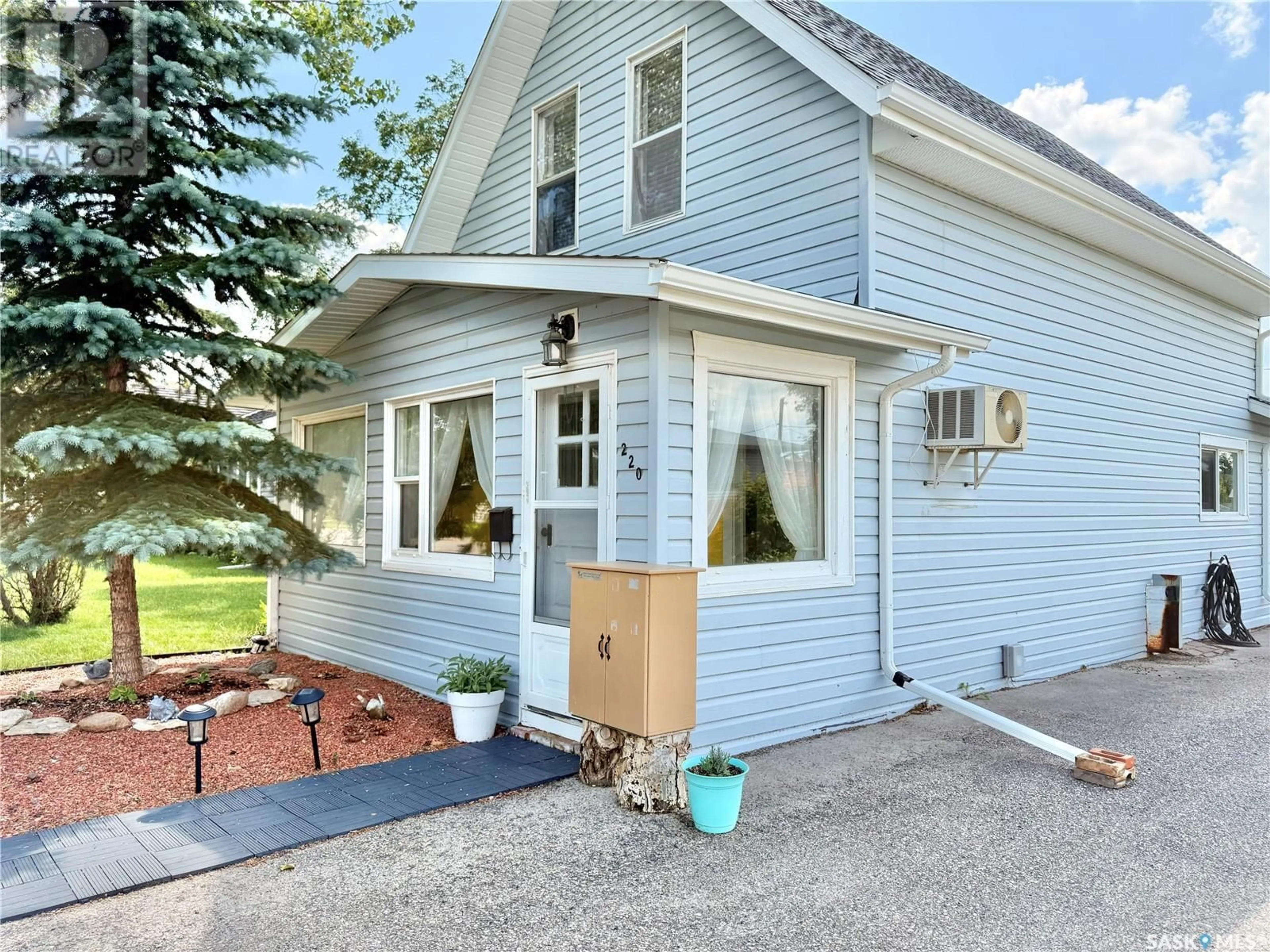 Home with vinyl exterior material, street for 220 DOUGLASS STREET, Outlook Saskatchewan S0L2N0