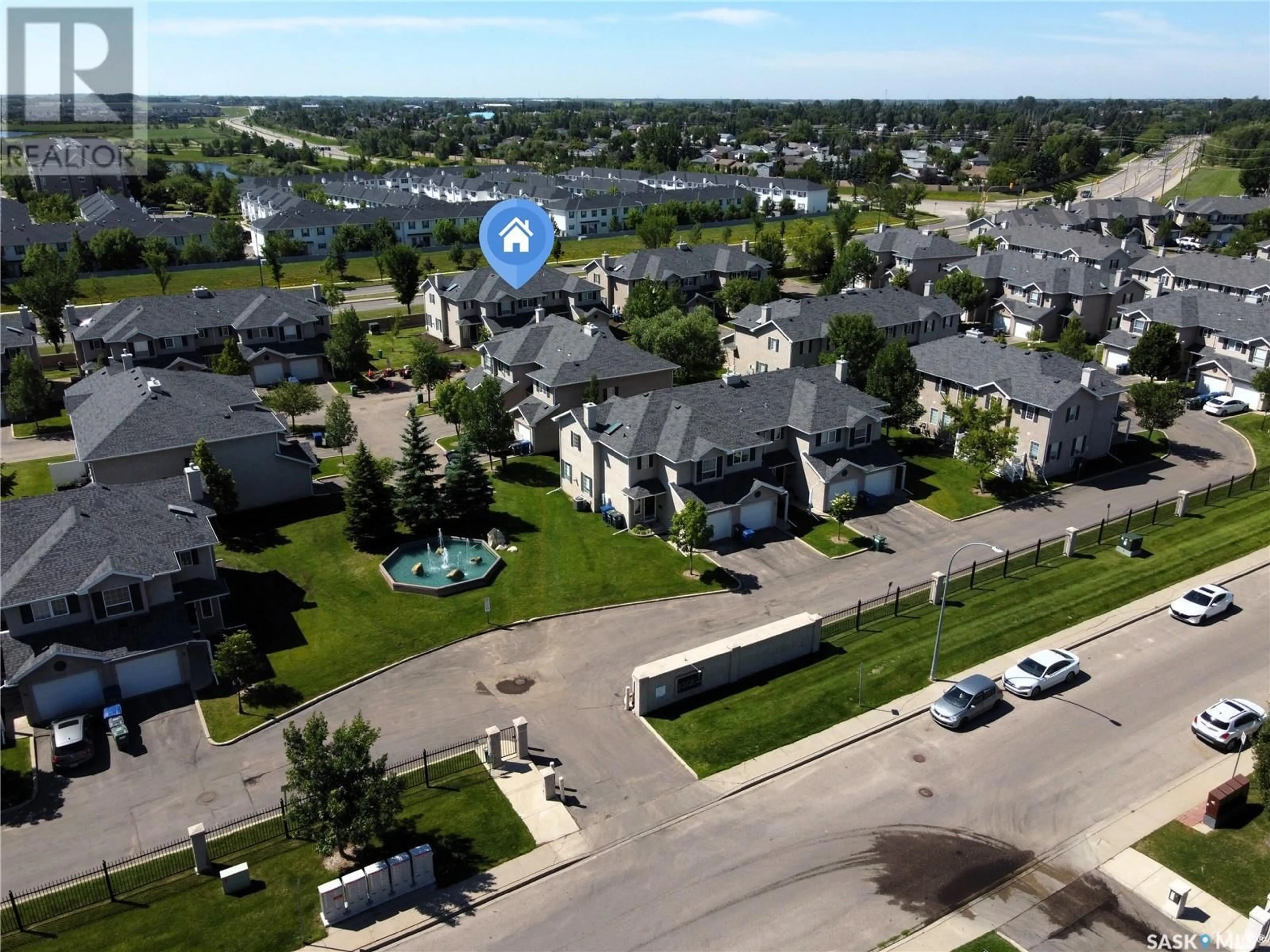 A pic from outside/outdoor area/front of a property/back of a property/a pic from drone, unknown for 127 - 28 BANYAN CRESCENT, Saskatoon Saskatchewan S7V1G5