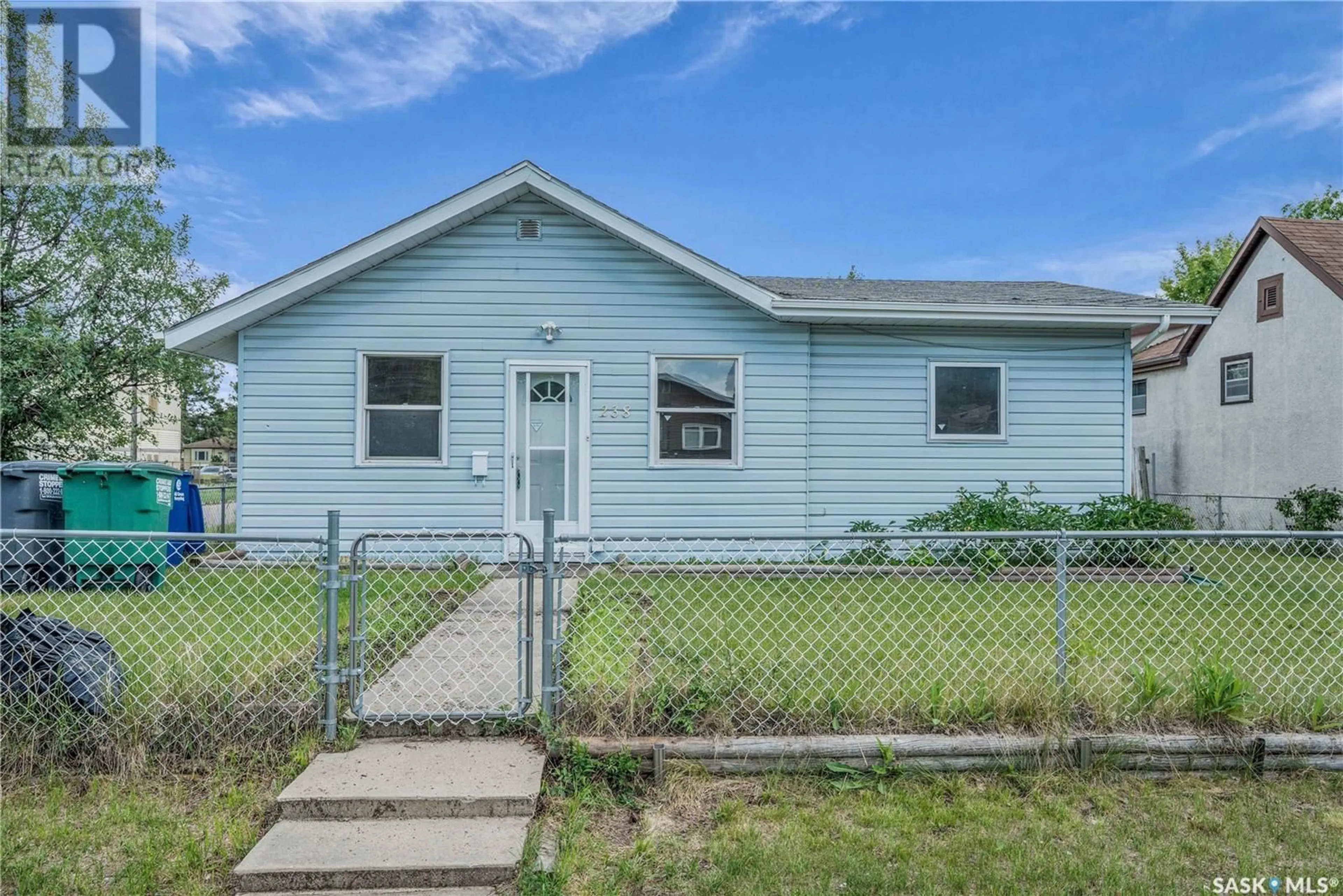 Home with vinyl exterior material, street for 238 R AVENUE, Saskatoon Saskatchewan S7L2Y7
