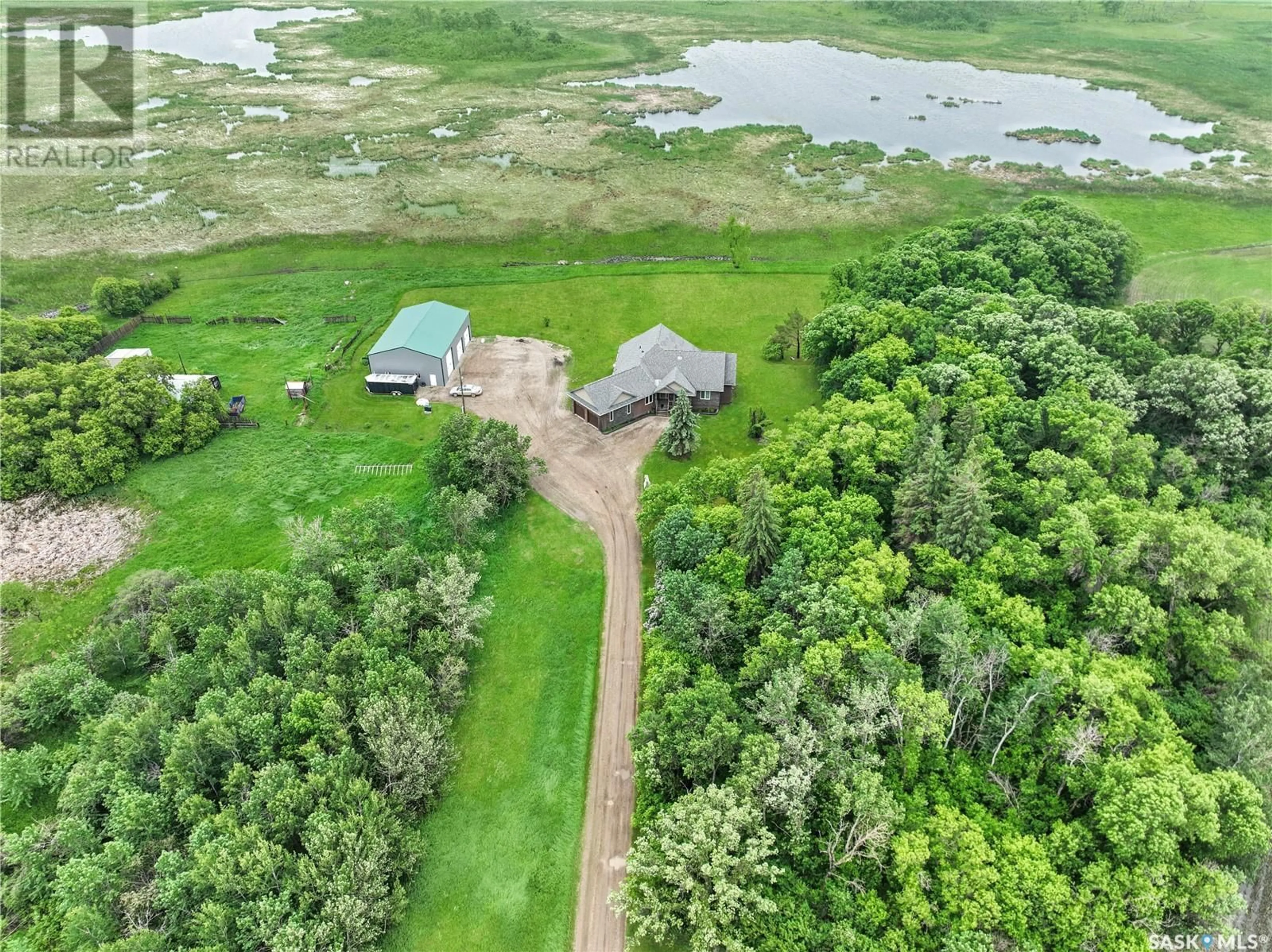 A pic from outside/outdoor area/front of a property/back of a property/a pic from drone, water/lake/river/ocean view for HOLARS HAVEN ACREAGE, Spy Hill Rm No. 152 Saskatchewan S0A4B0