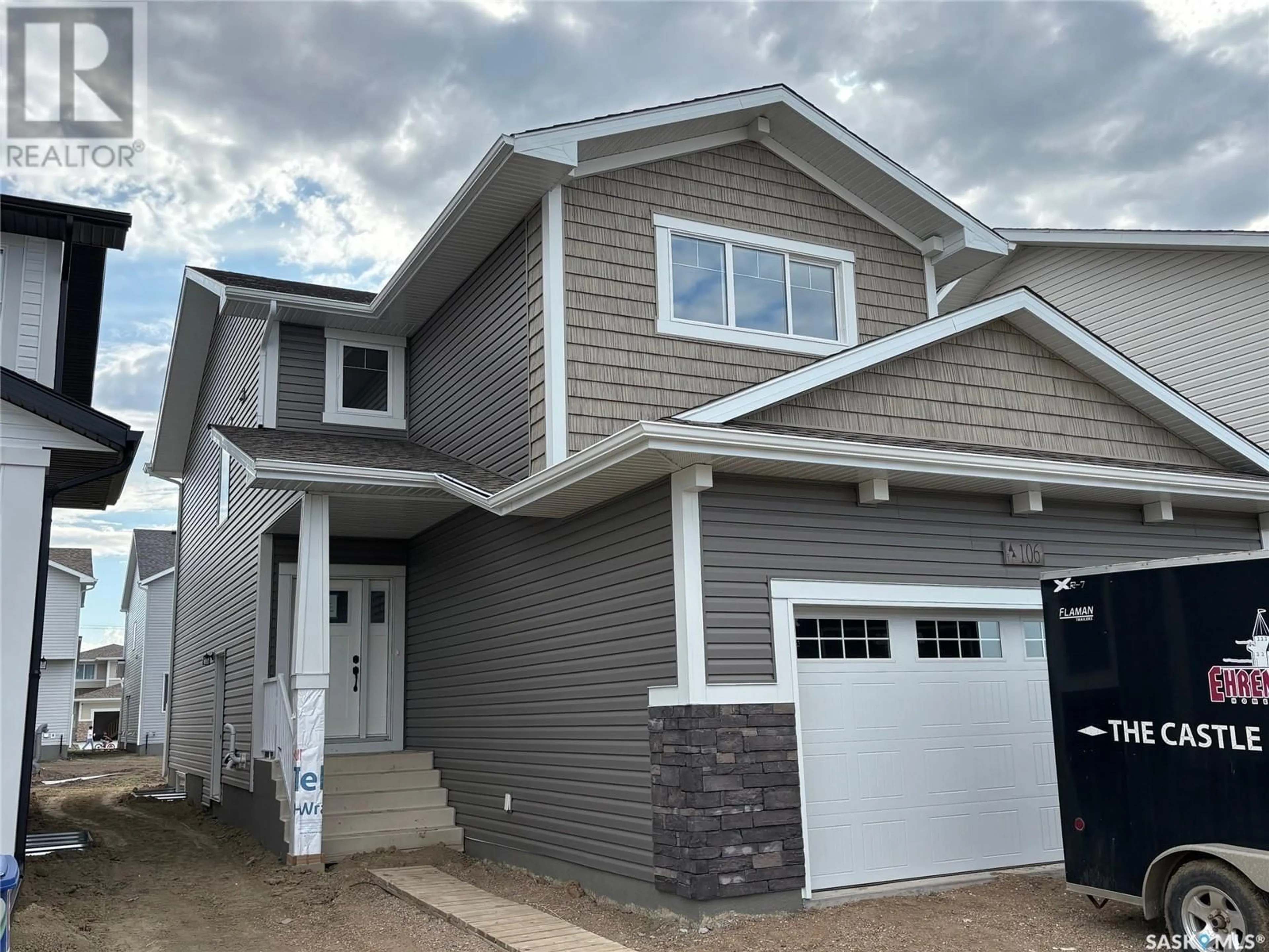 Home with vinyl exterior material, street for 106 KATZ AVENUE, Saskatoon Saskatchewan S7V1S9