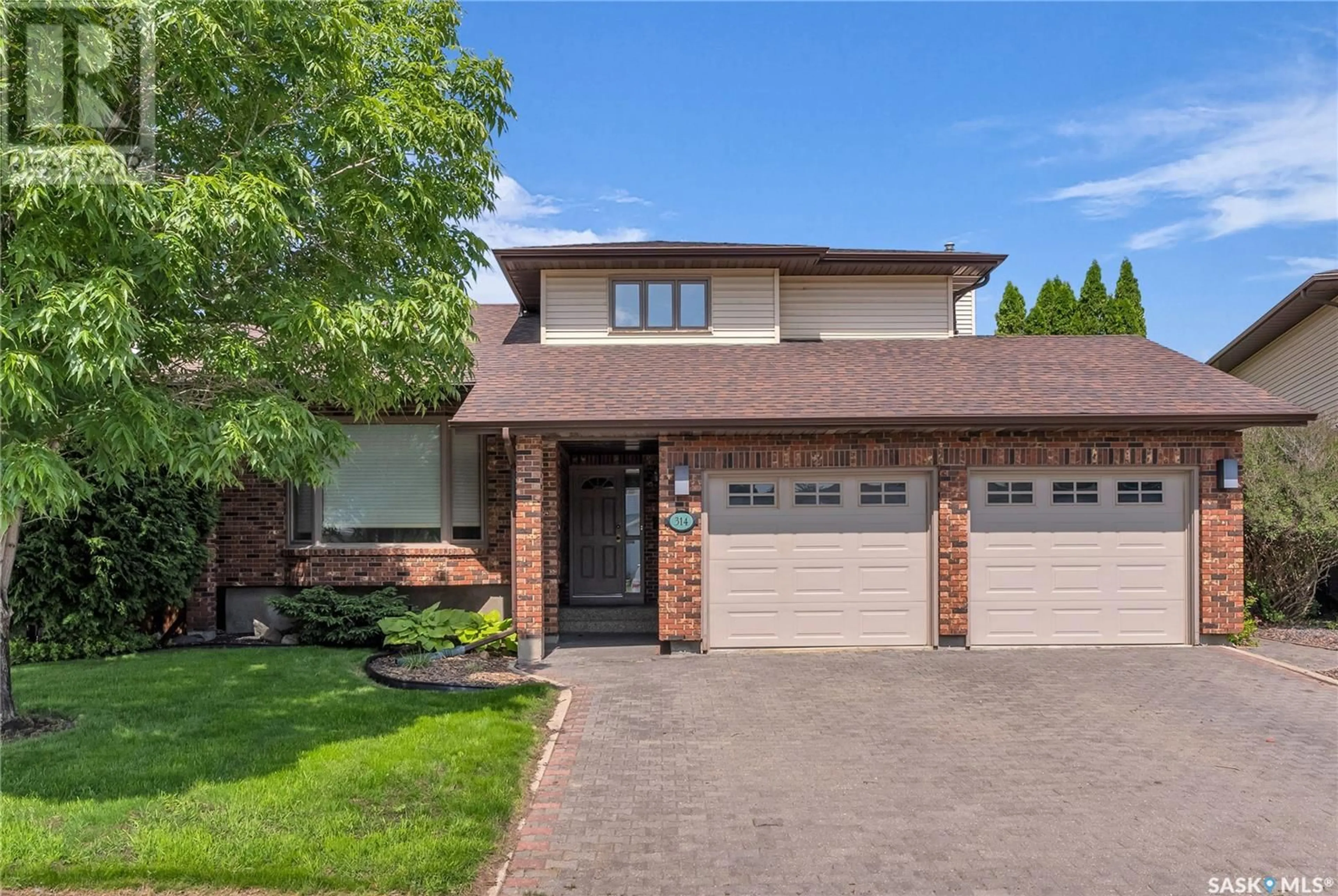 Home with brick exterior material, street for 314 WHITEWOOD ROAD, Saskatoon Saskatchewan S7J4L8