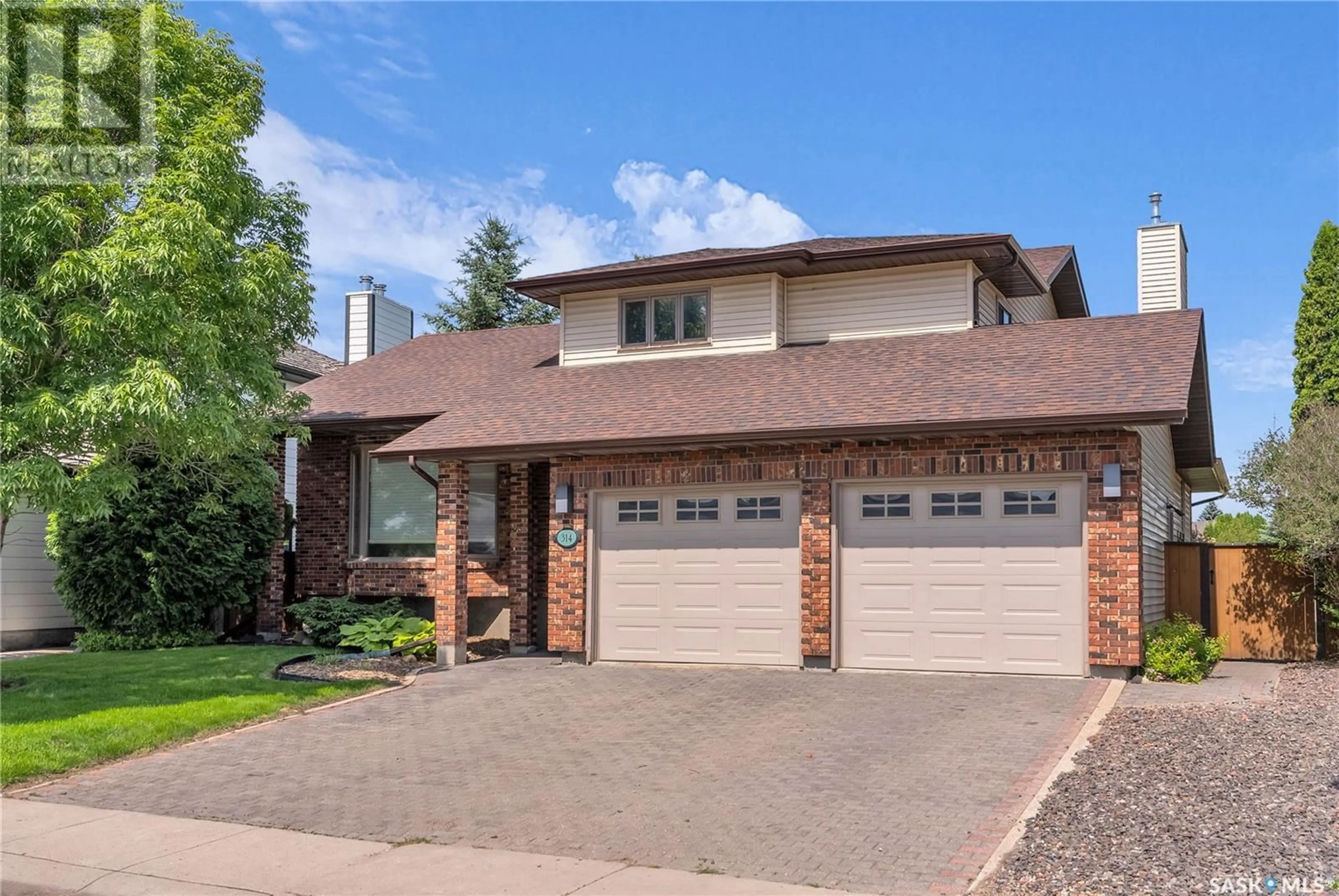 Home with brick exterior material, street for 314 WHITEWOOD ROAD, Saskatoon Saskatchewan S7J4L8