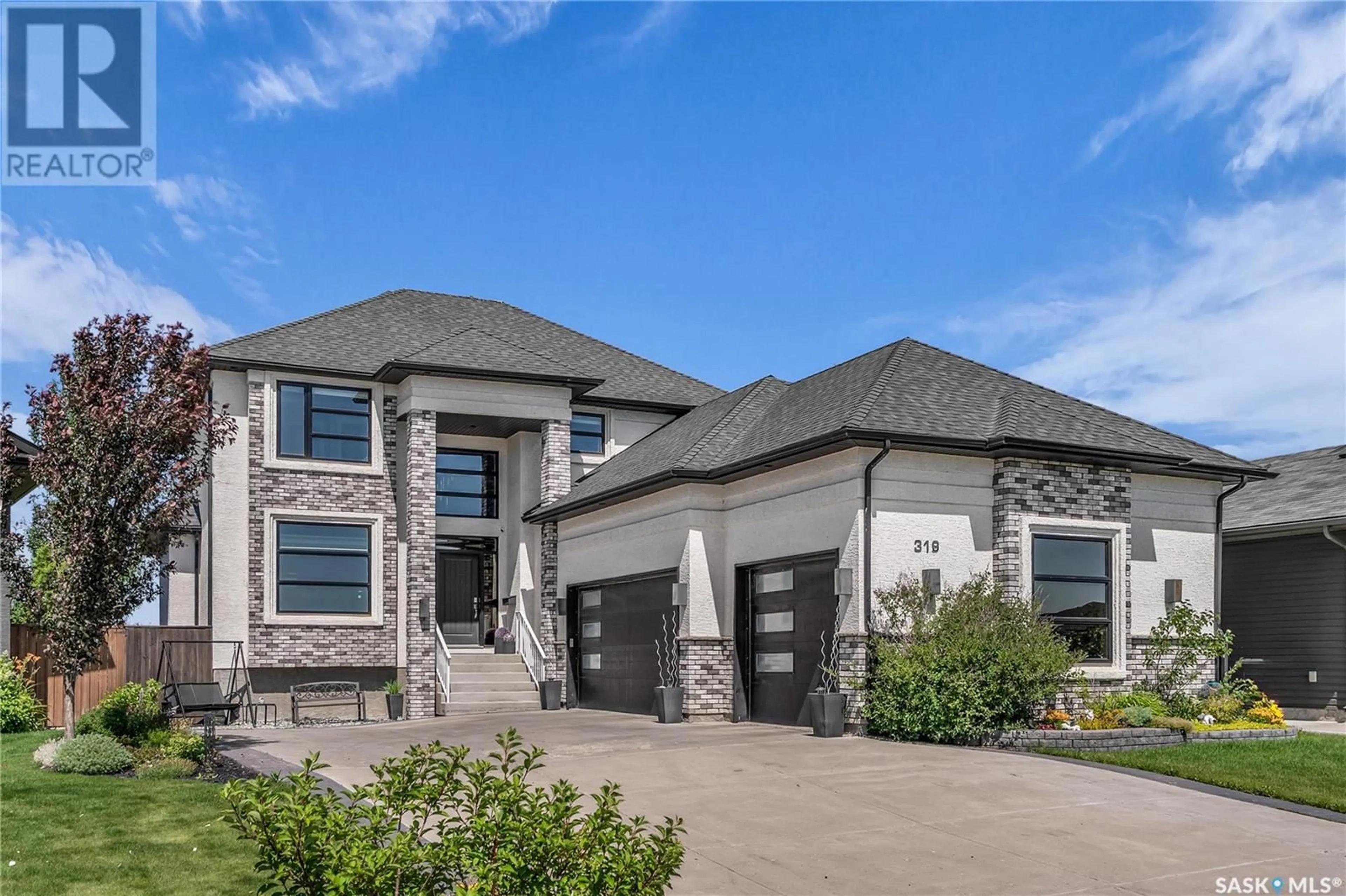 Home with brick exterior material, street for 319 HARGREAVES GREEN, Saskatoon Saskatchewan S7R0H9