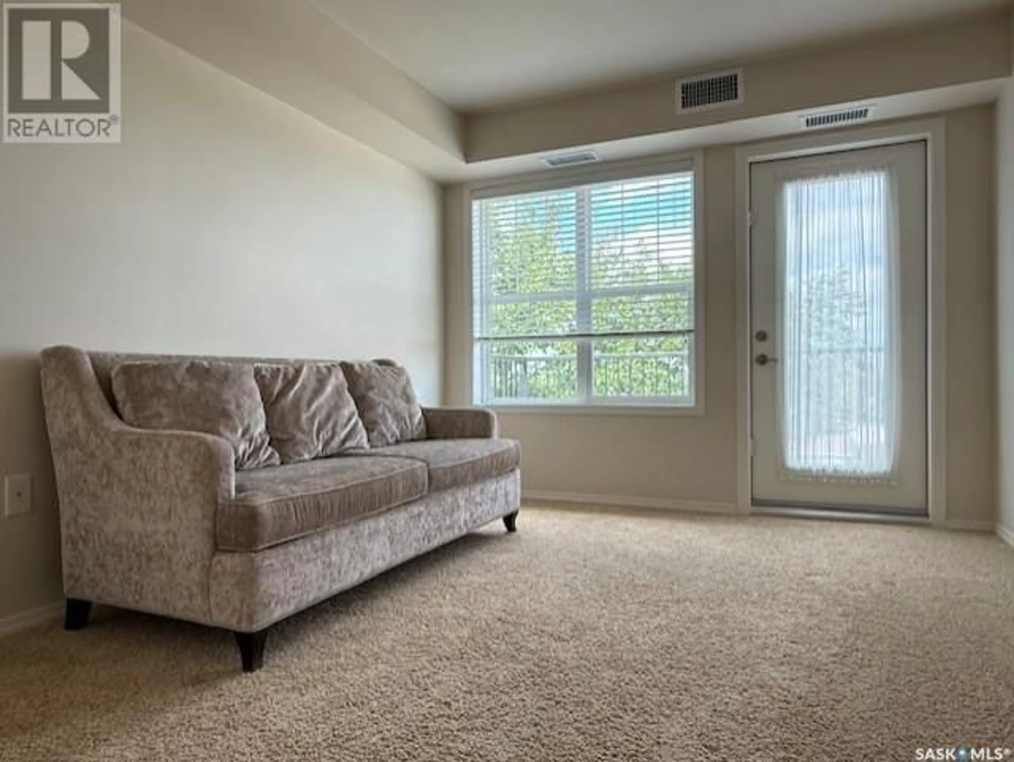 Living room with furniture, carpet floor for E - 418 680 7TH AVENUE, Melville Saskatchewan S0A2P1