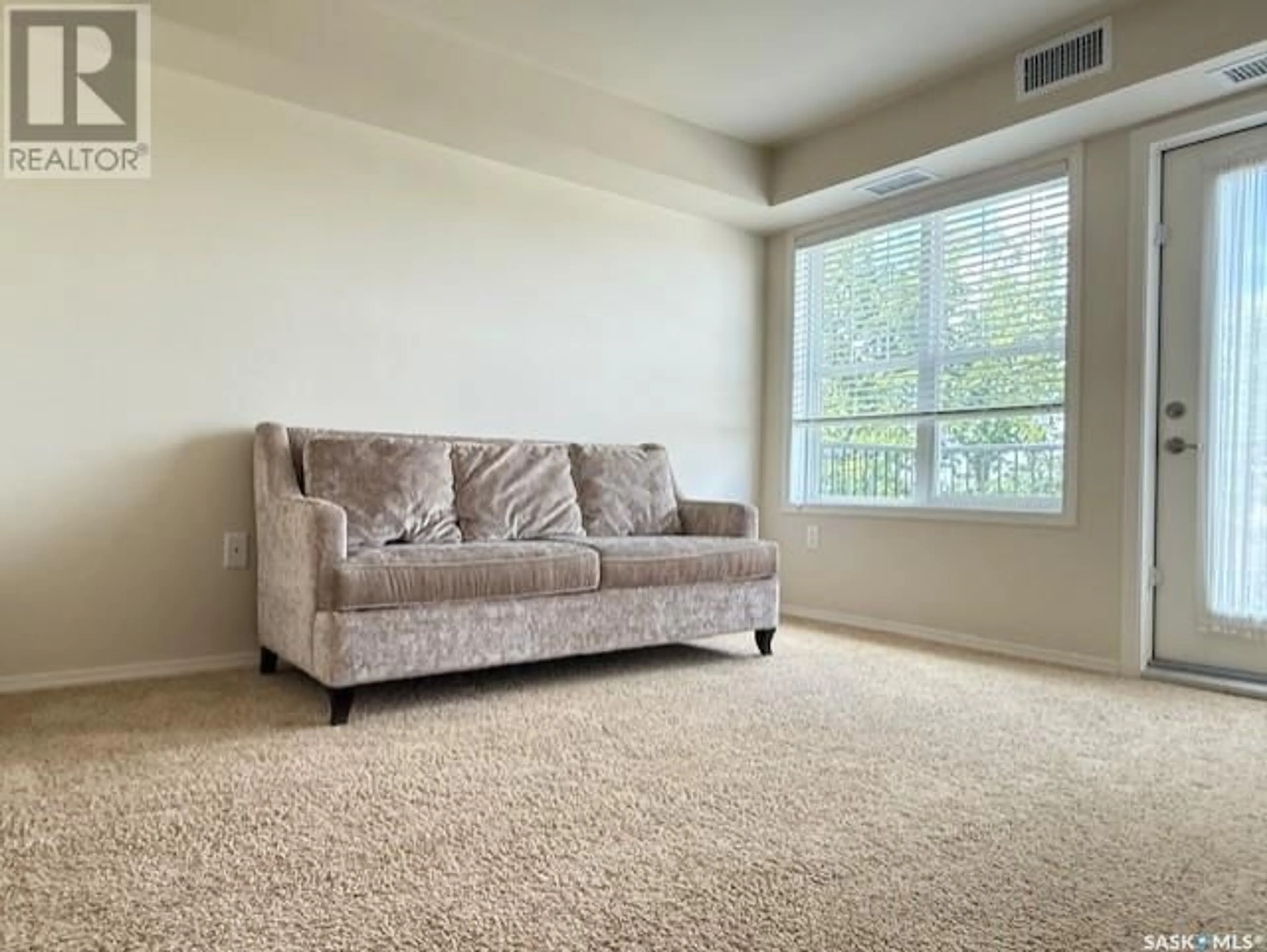 Living room with furniture, carpet floor for E - 418 680 7TH AVENUE, Melville Saskatchewan S0A2P1