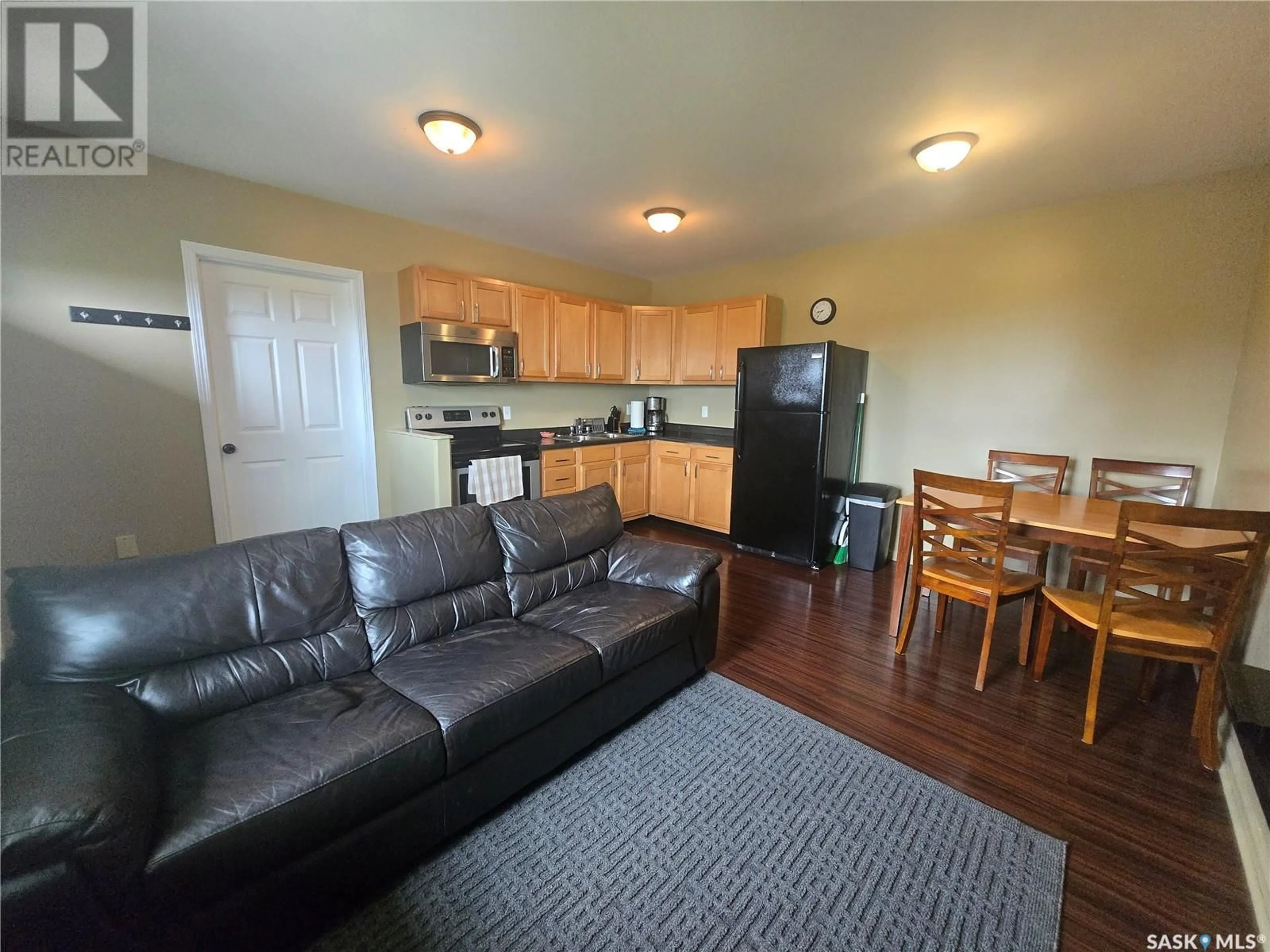 Living room with furniture, wood/laminate floor for 495 SECOND AVENUE, Benson Rm No. 35 Saskatchewan S0C0L0