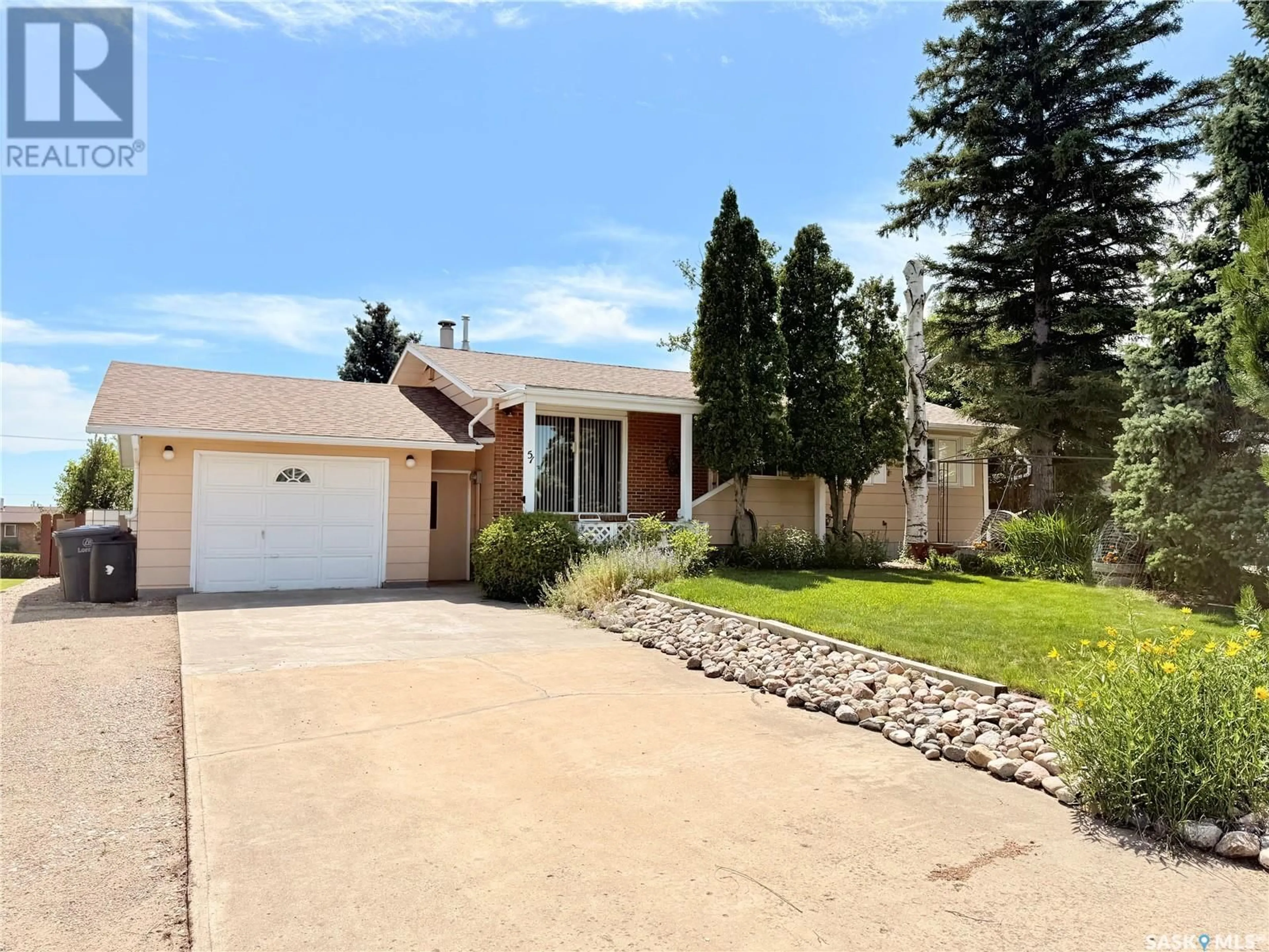 Home with brick exterior material, street for 51 TUFTS CRESCENT, Outlook Saskatchewan S0L2N0