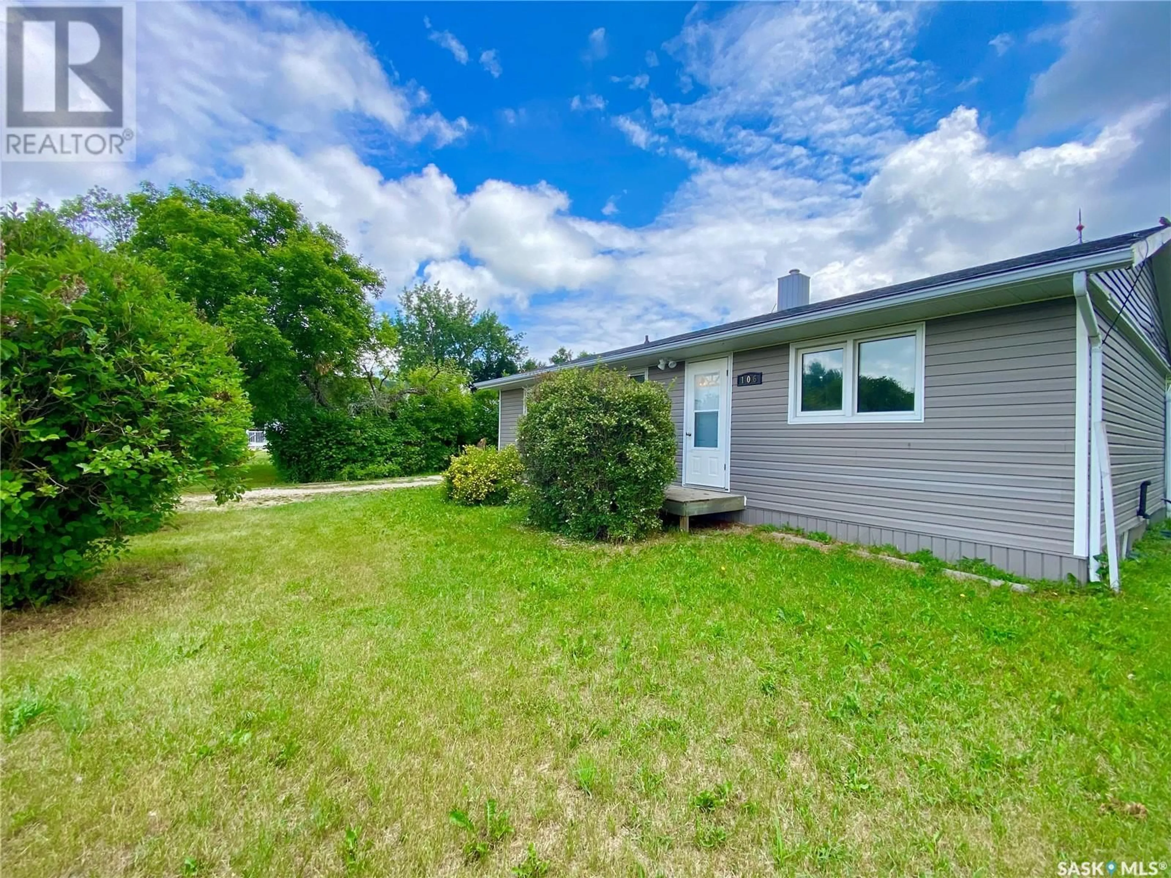 A pic from outside/outdoor area/front of a property/back of a property/a pic from drone, water/lake/river/ocean view for 106 MAIN STREET, Midale Saskatchewan S0C1S0