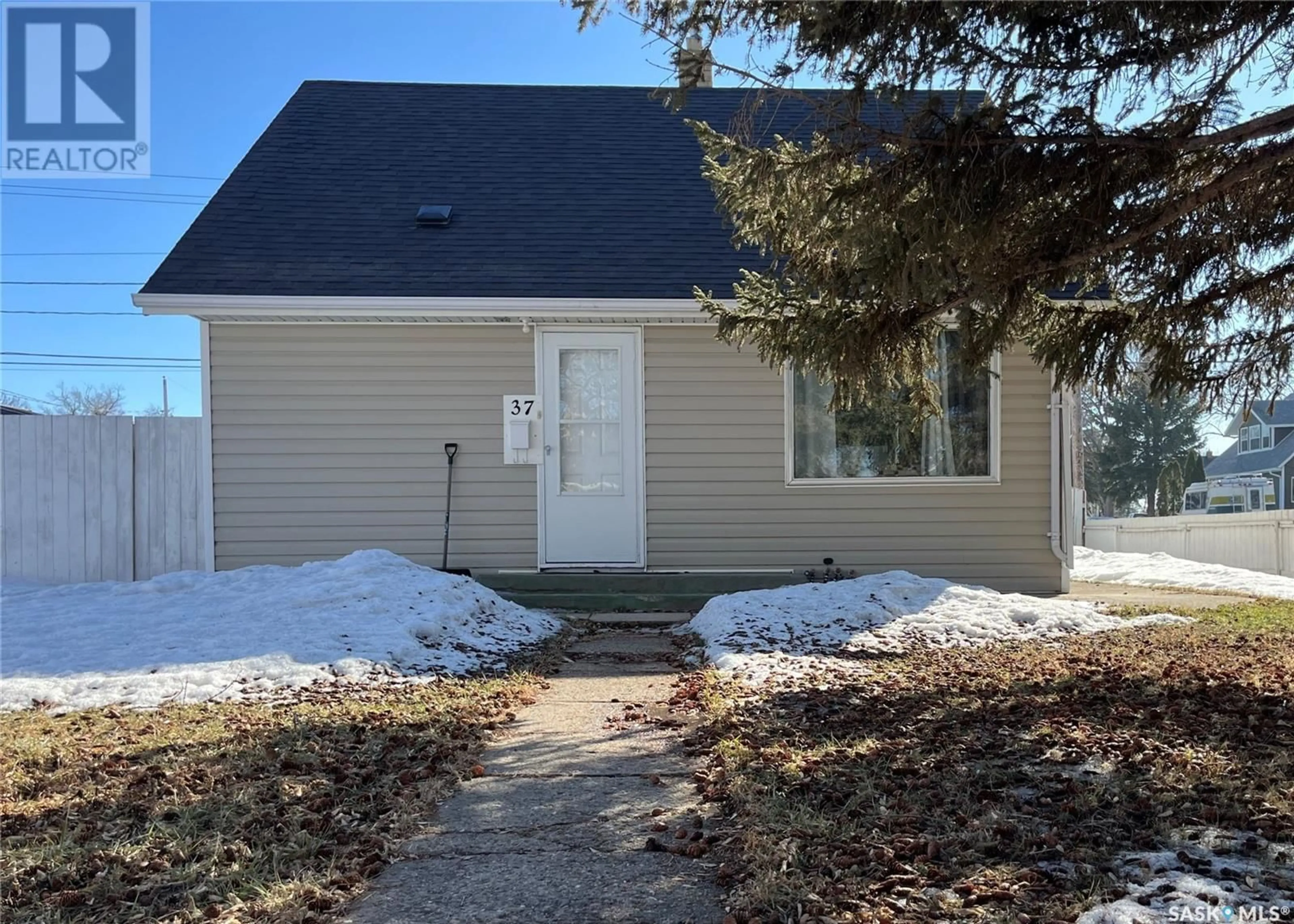 Home with vinyl exterior material, street for 37 COTEAU STREET, Moose Jaw Saskatchewan S6H5C2