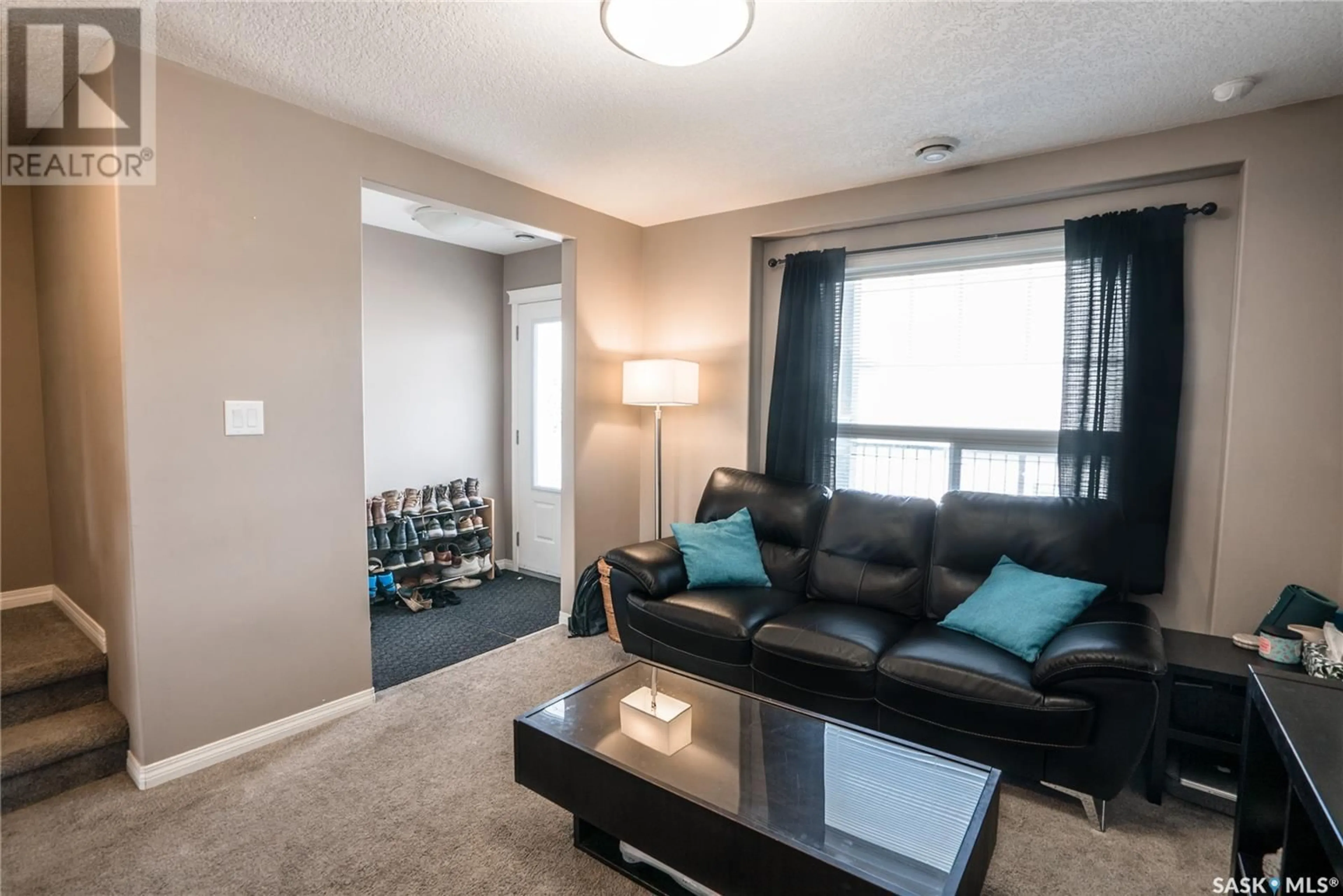 Living room with furniture, carpet floor for 103 - 411 KLASSEN CRESCENT, Saskatoon Saskatchewan S7R0J2