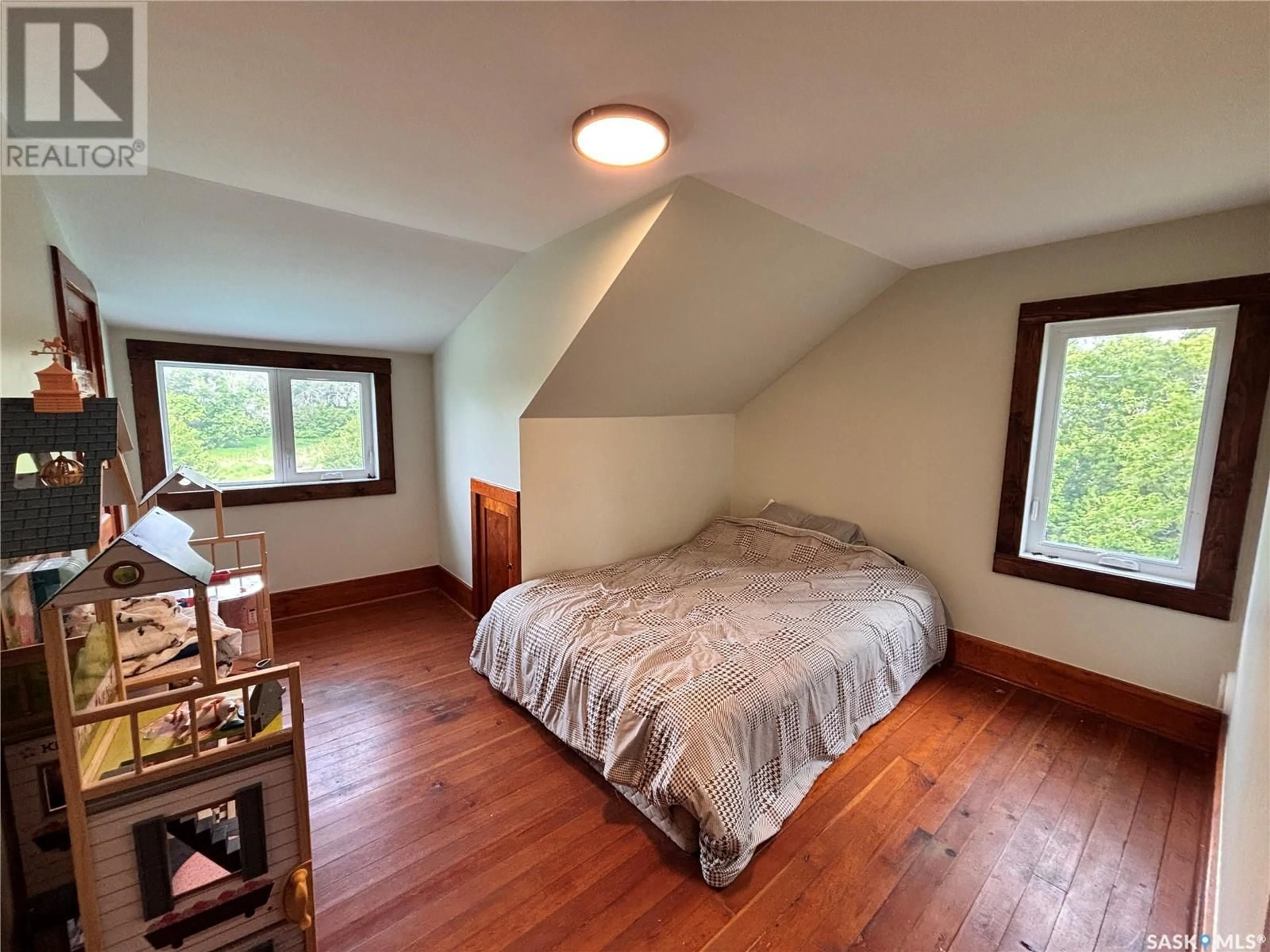 Bedroom with bed, wood/laminate floor for SOUTH STOCKWELL LAKE ACREAGE, Fertile Valley Rm No. 285 Saskatchewan S0L0L0