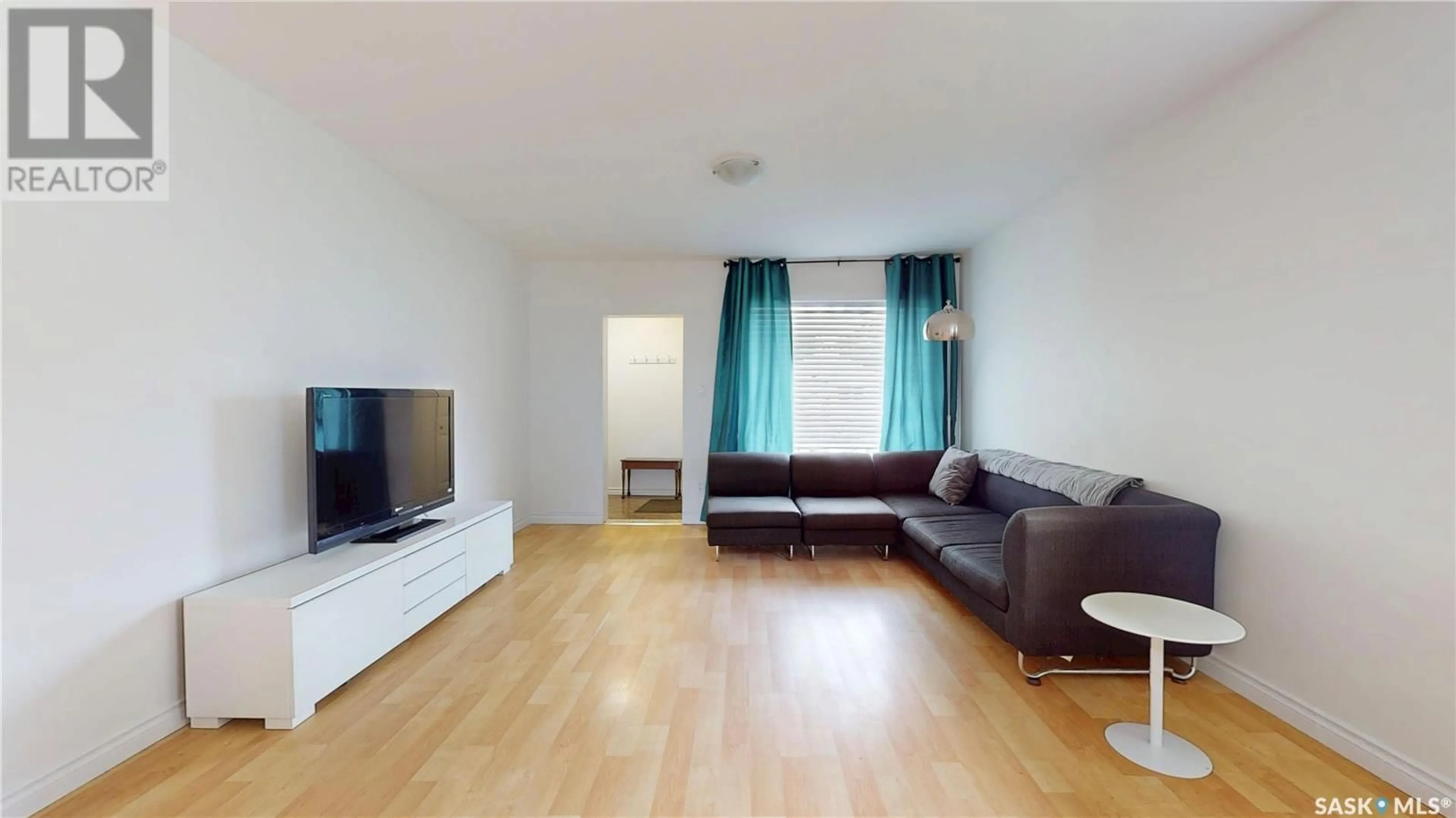Living room with furniture, wood/laminate floor for 1048 ATHOL STREET, Regina Saskatchewan S4T3B9