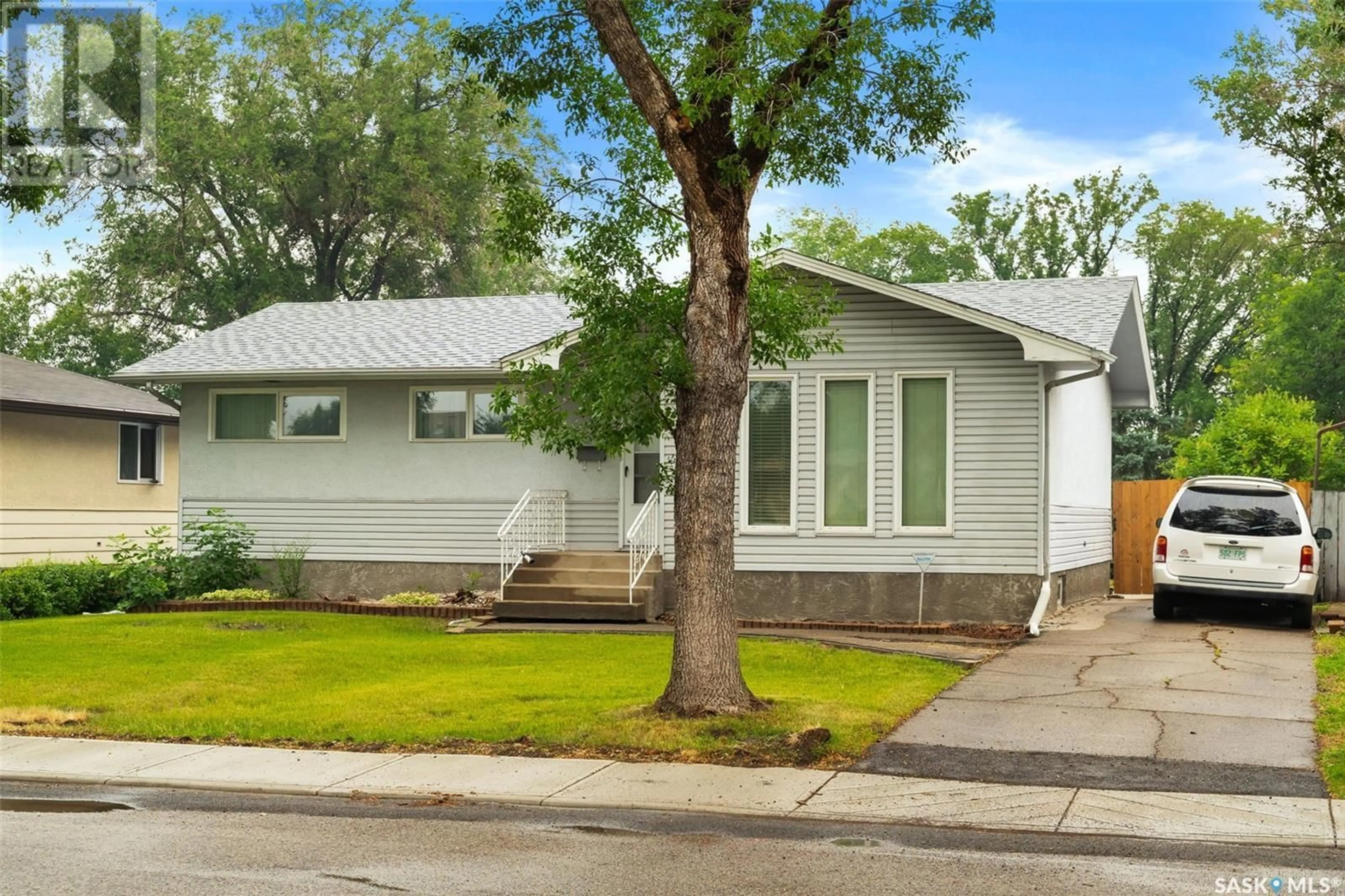 Home with vinyl exterior material, street for 14 HAMMOND ROAD, Regina Saskatchewan S4R3C6