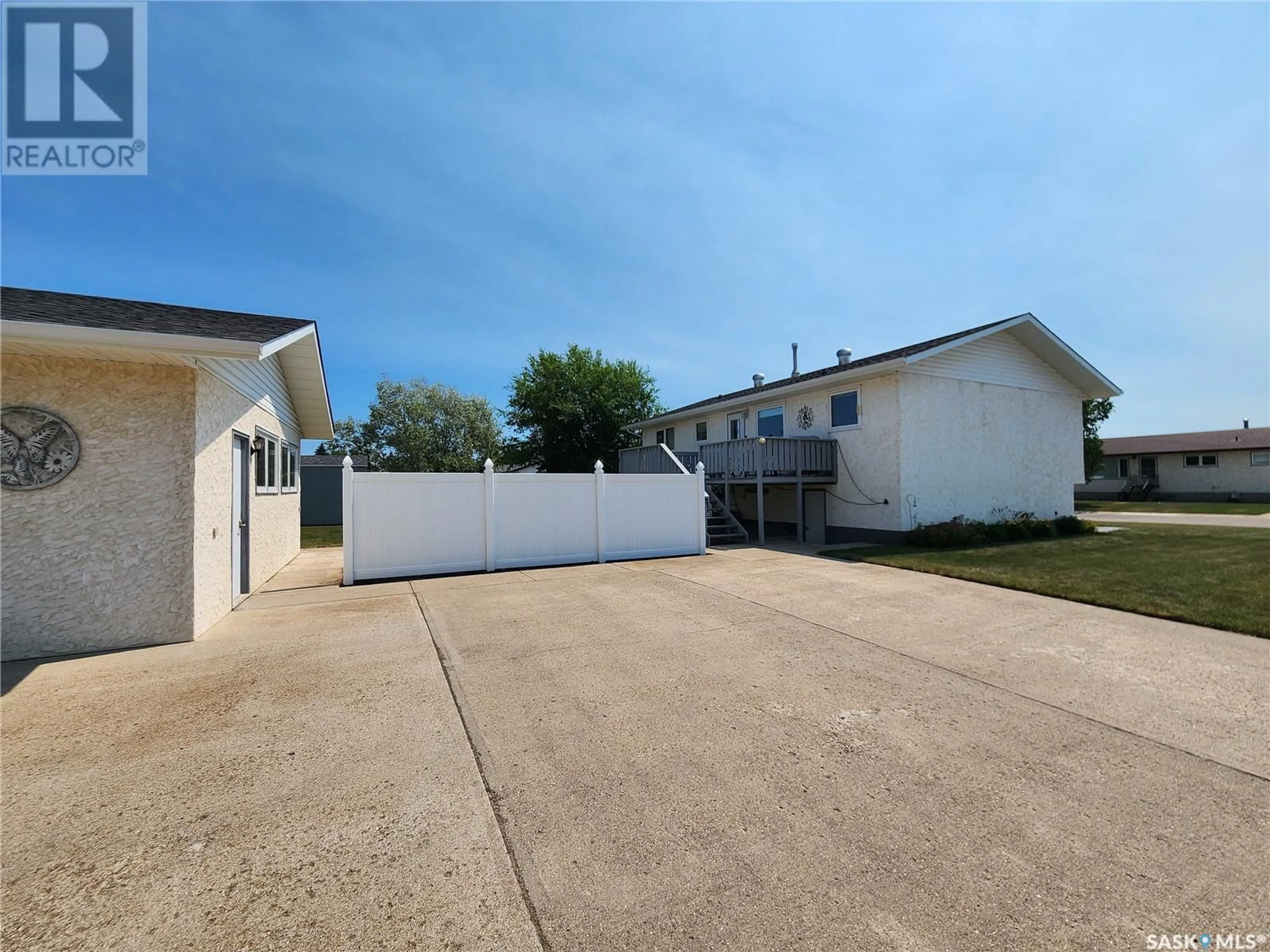 A pic from outside/outdoor area/front of a property/back of a property/a pic from drone, street for 1 CENTENNIAL CRESCENT, Melville Saskatchewan S0A2P0