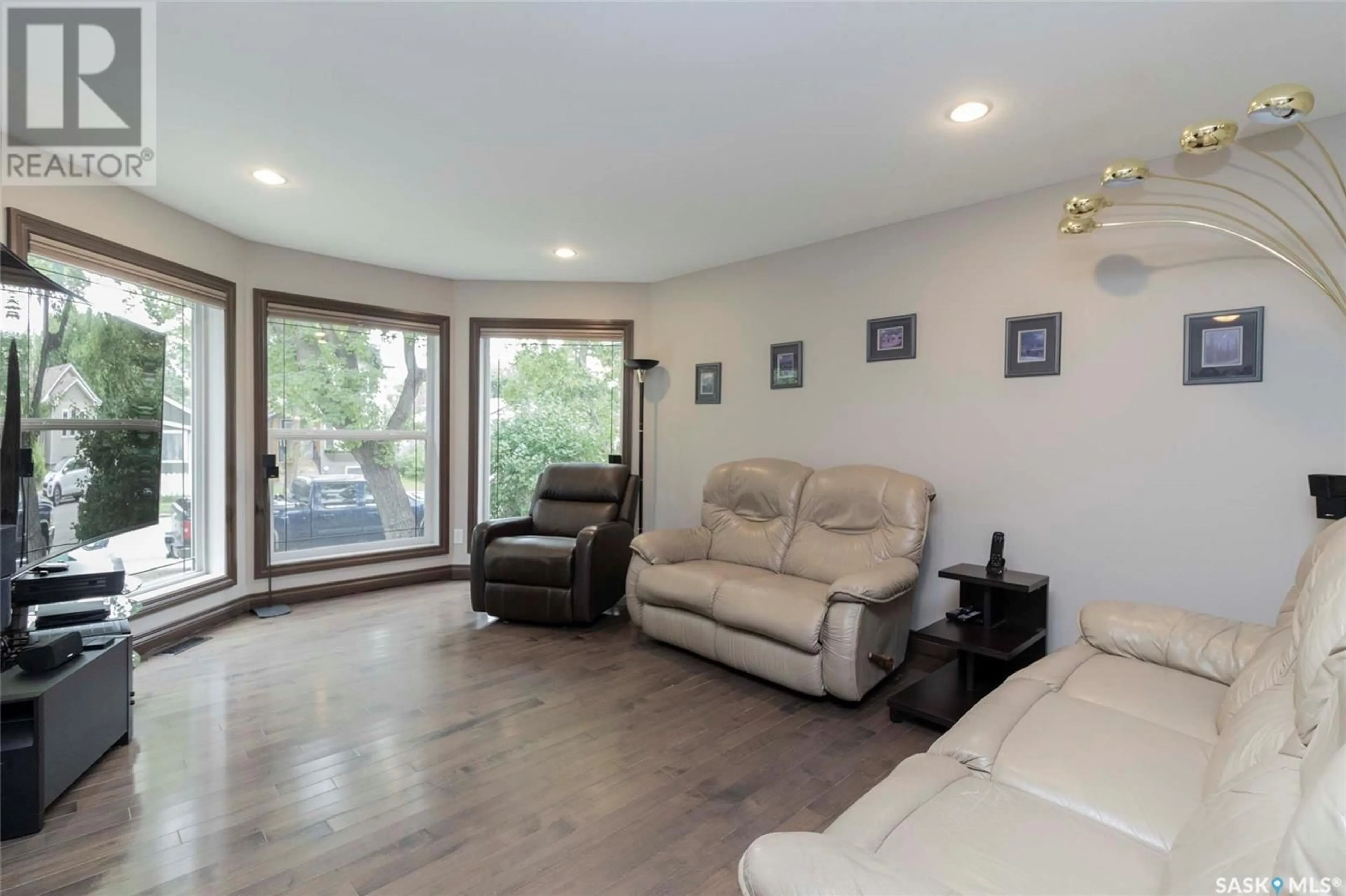 Living room with furniture, wood/laminate floor for 1405 7TH AVENUE, Saskatoon Saskatchewan S7K2W3
