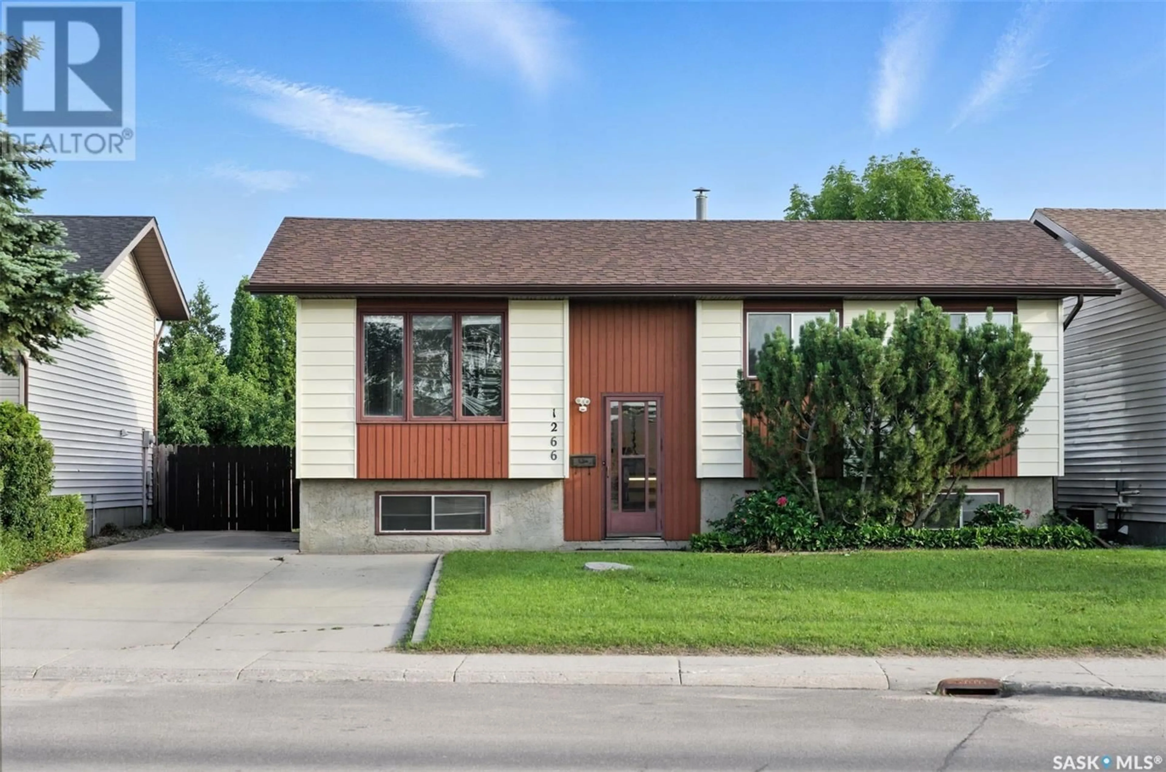 Home with brick exterior material, street for 1266 MCCORMACK ROAD, Saskatoon Saskatchewan S7M5L9
