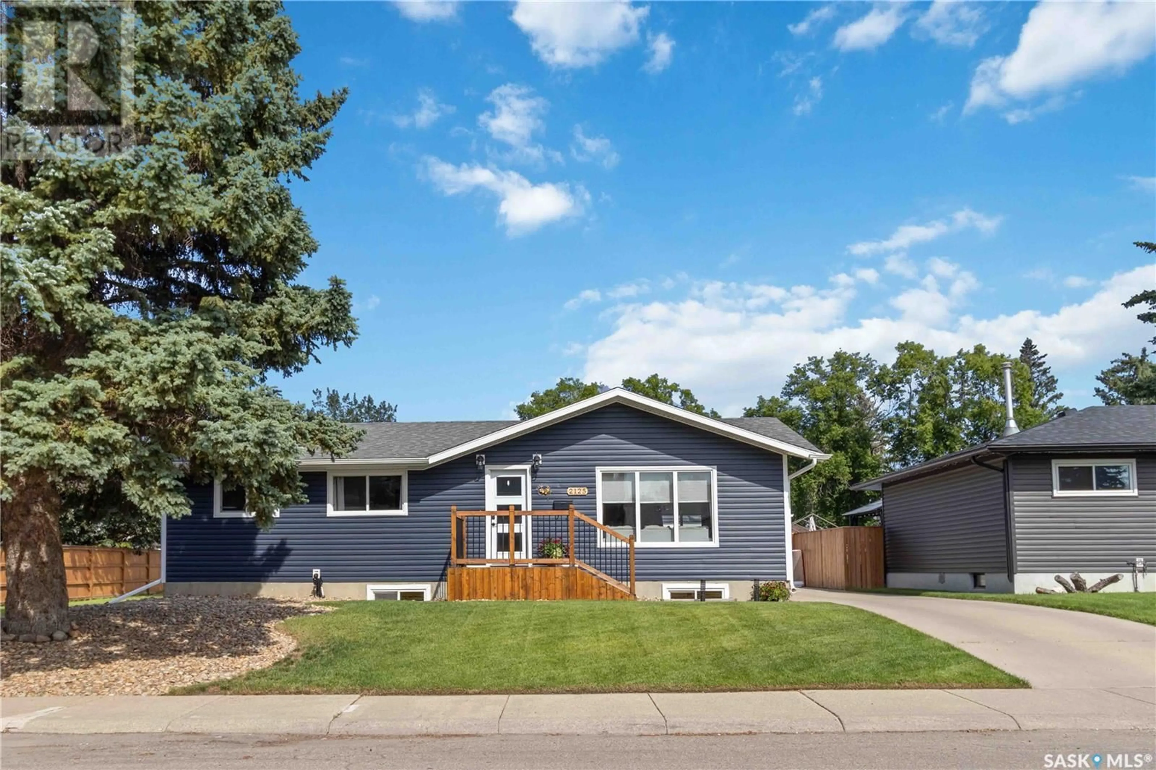 Home with vinyl exterior material, street for 2125 EASTHILL, Saskatoon Saskatchewan S7J3C8