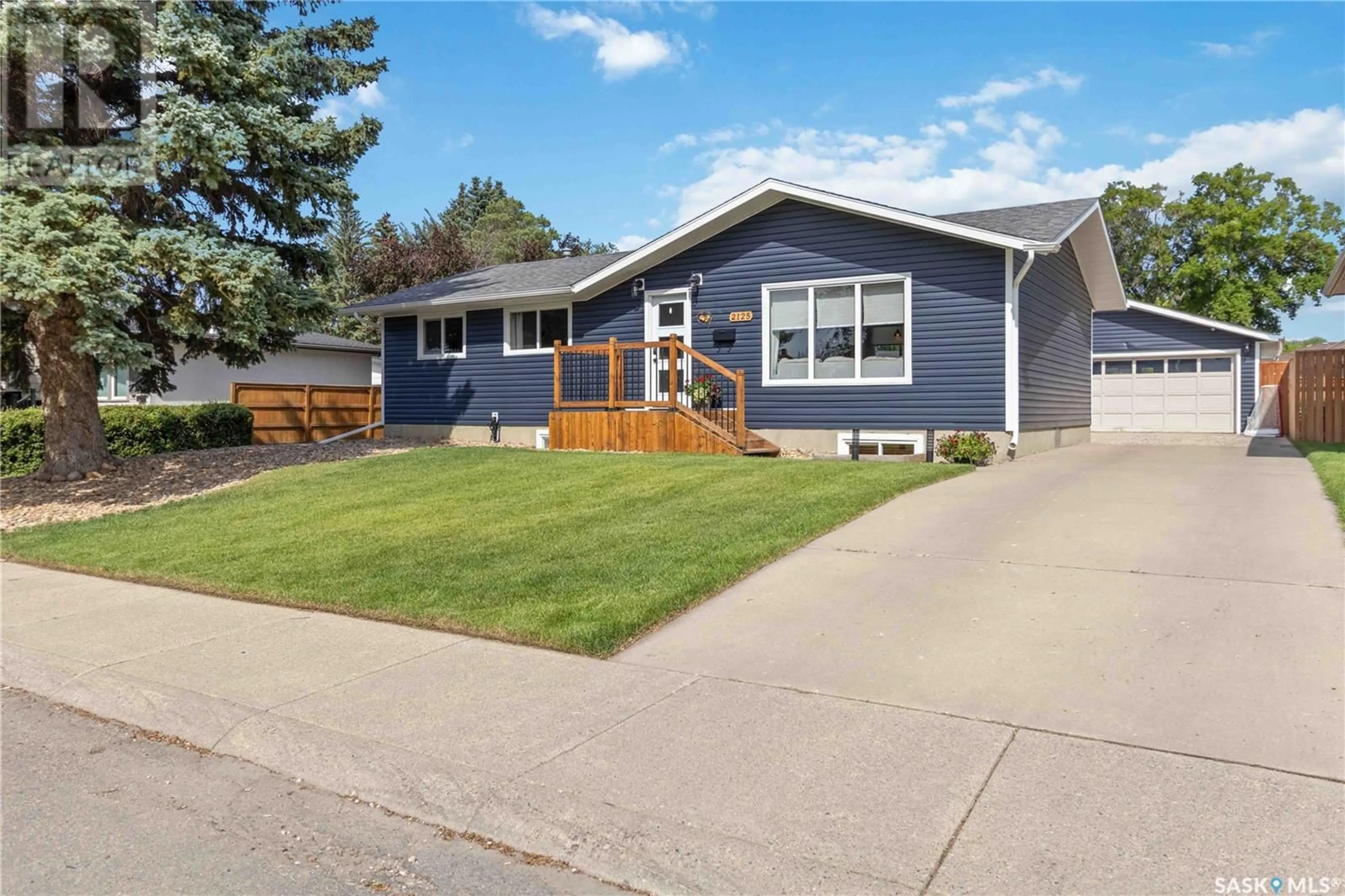Home with vinyl exterior material, street for 2125 EASTHILL, Saskatoon Saskatchewan S7J3C8