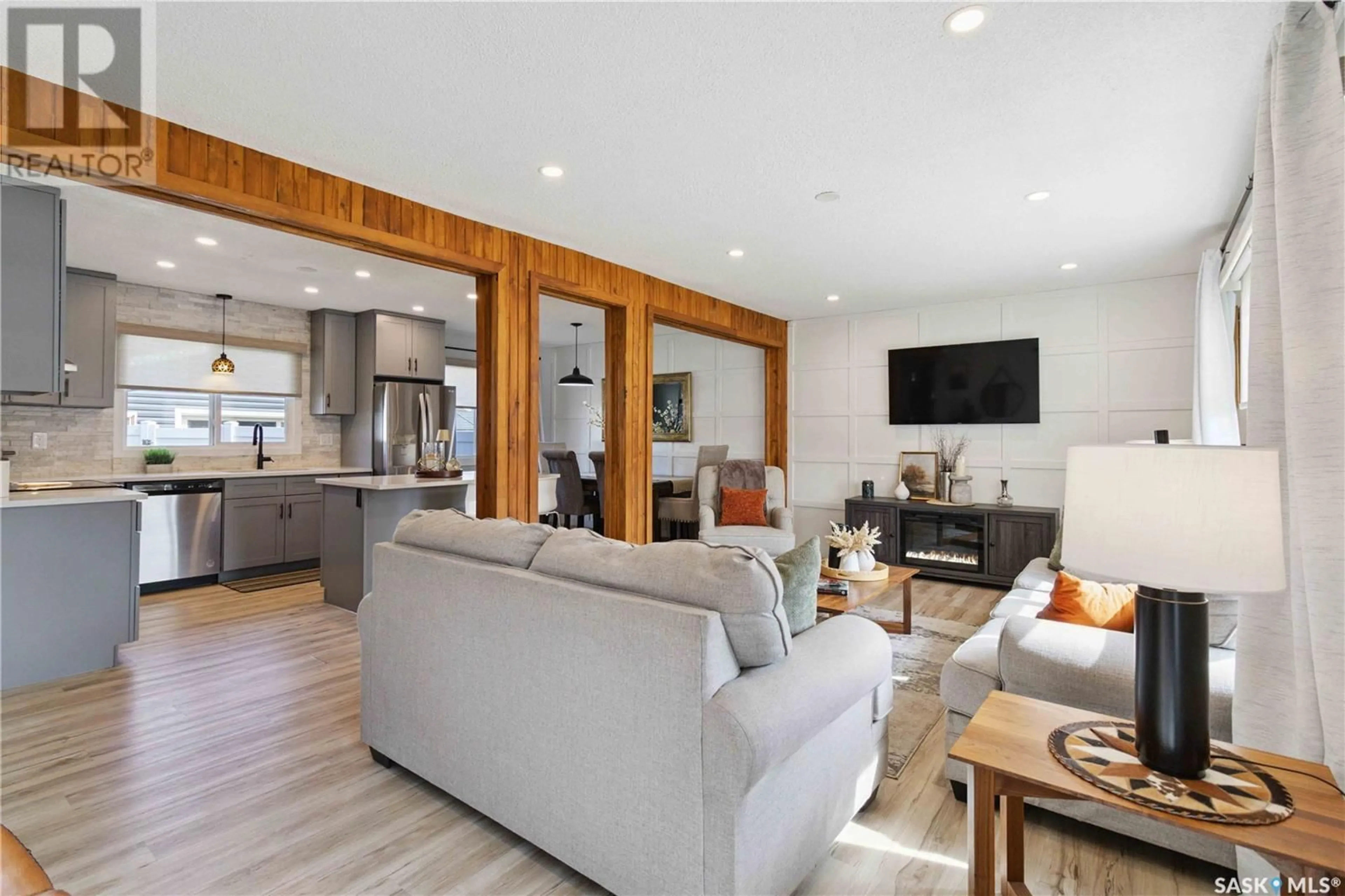 Living room with furniture, wood/laminate floor for 2125 EASTHILL, Saskatoon Saskatchewan S7J3C8