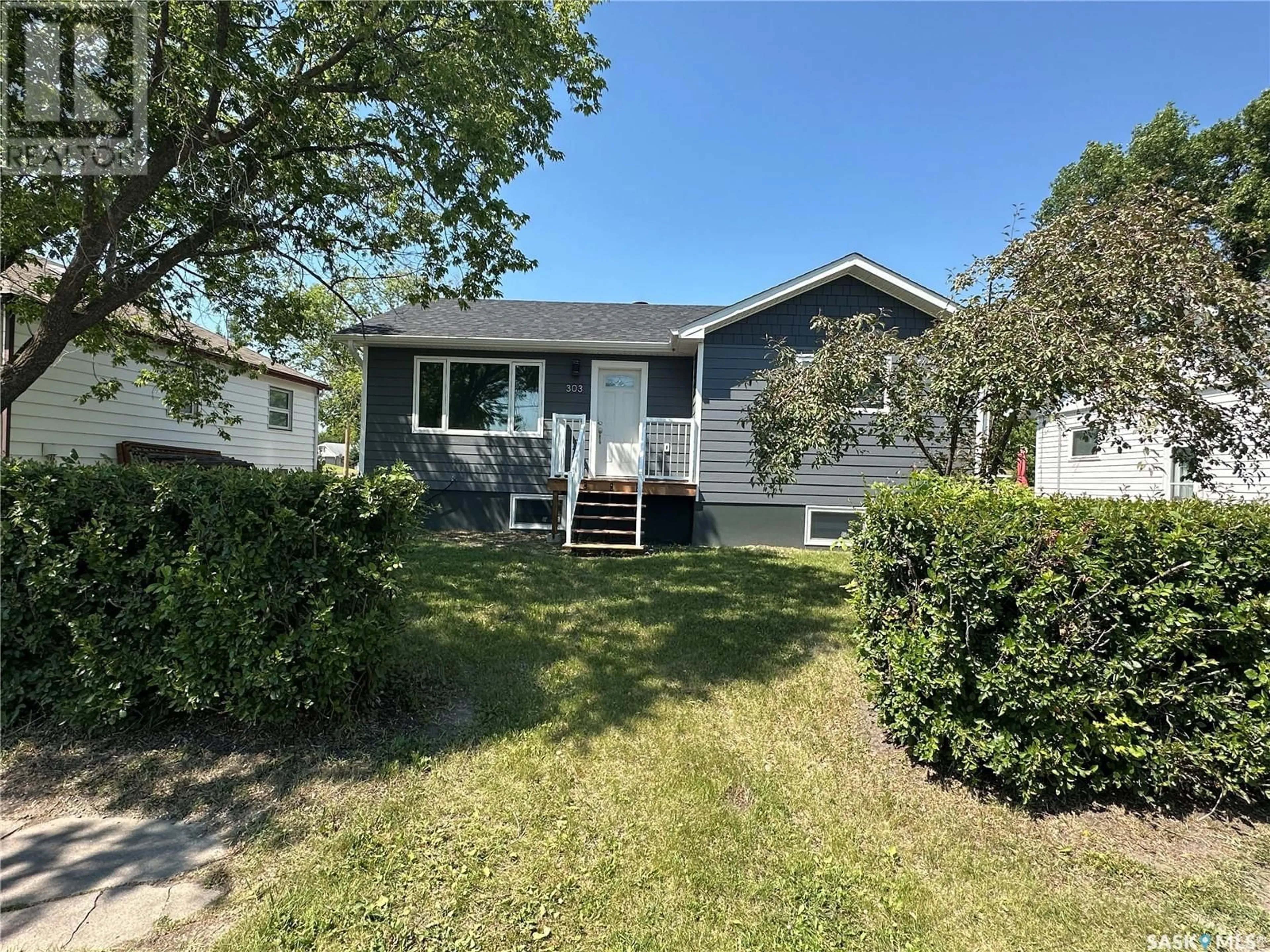 A pic from outside/outdoor area/front of a property/back of a property/a pic from drone, unknown for 303 2ND STREET, Watson Saskatchewan S0K4V0