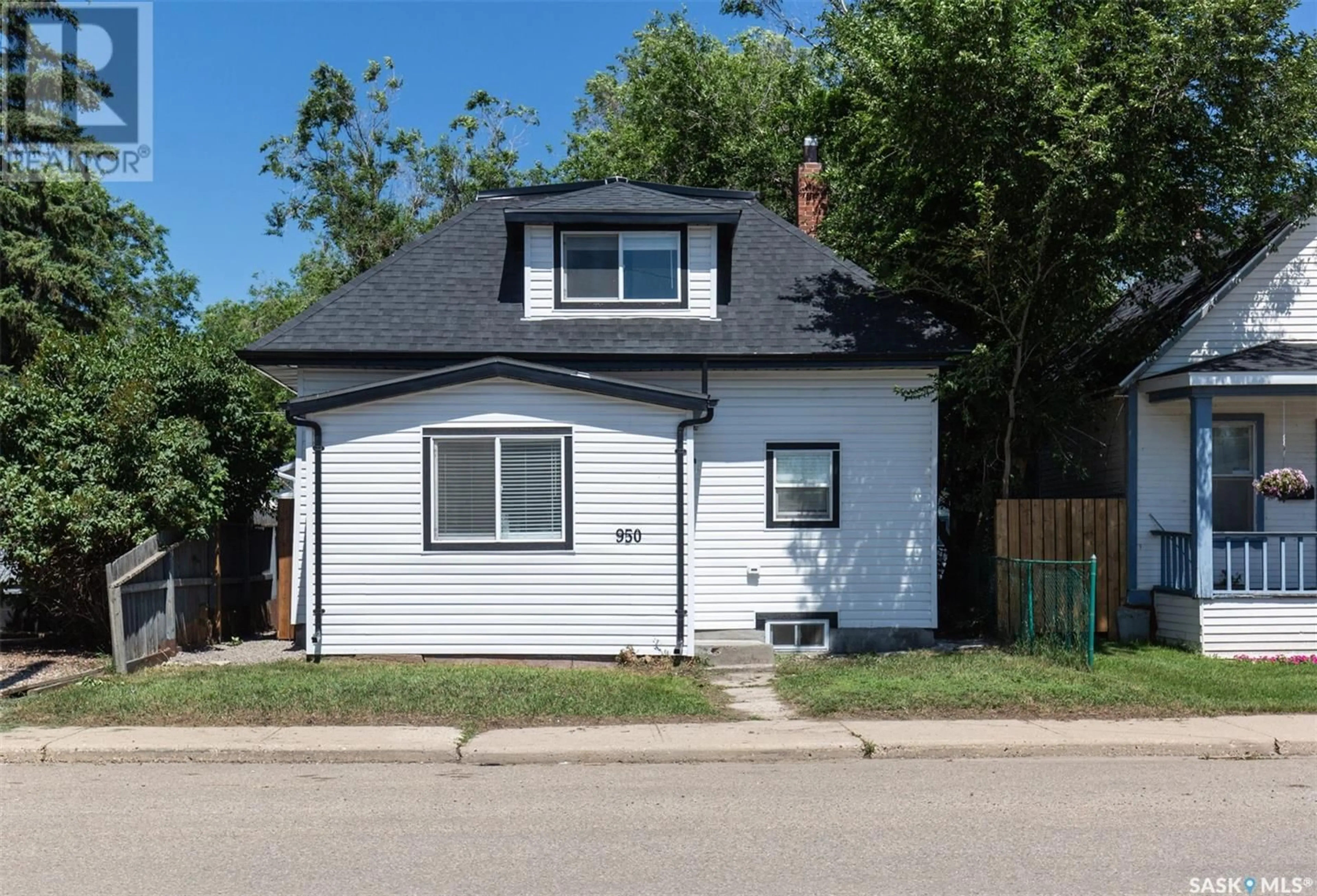 Home with vinyl exterior material, street for 950 OMINICA STREET, Moose Jaw Saskatchewan S6H1X7