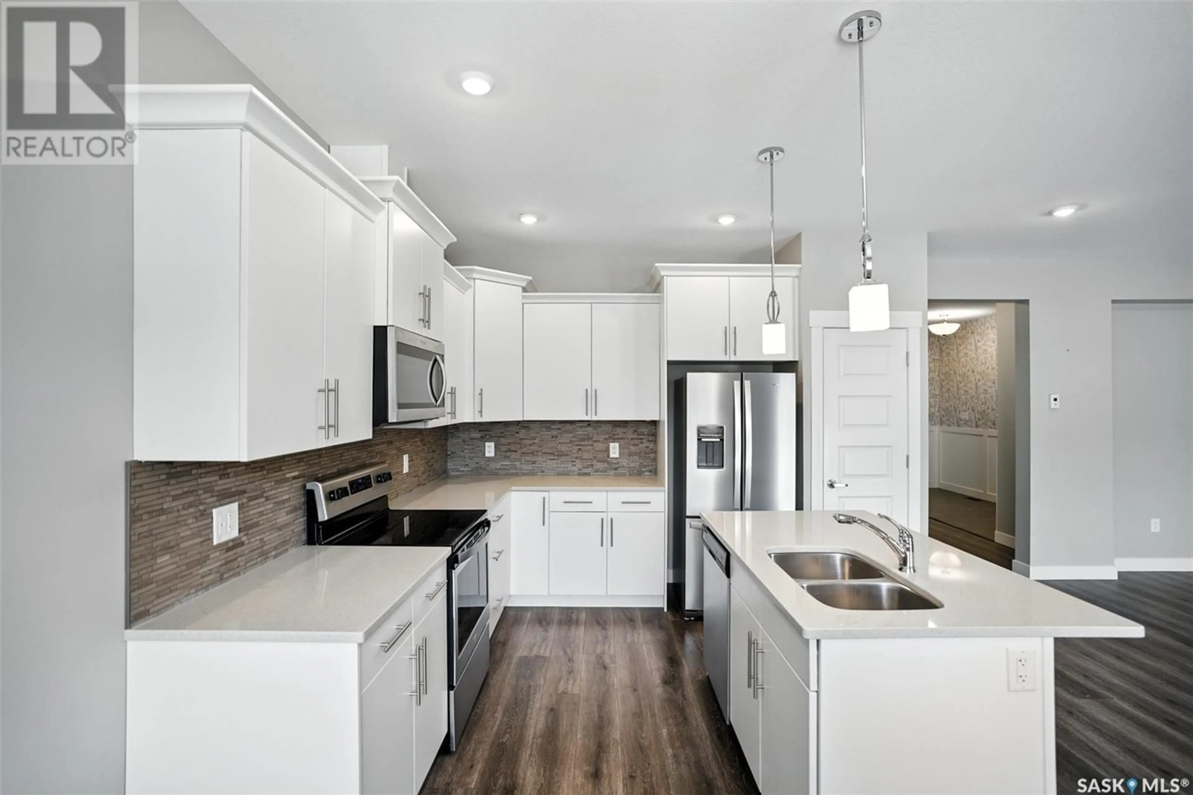 Open concept kitchen, ceramic/tile floor for 21 900 ST ANDREWS LANE, Warman Saskatchewan S0K4S4