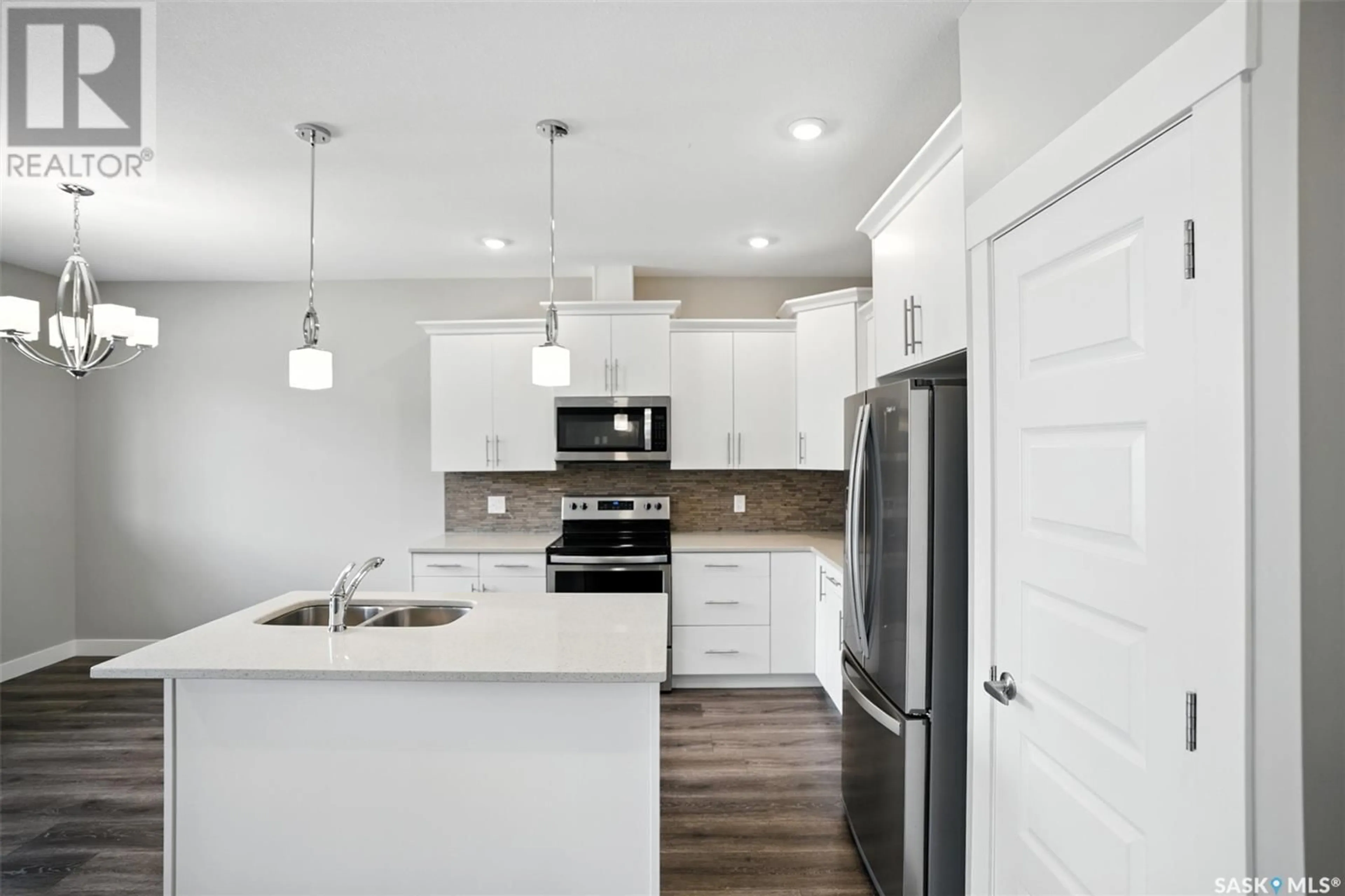 Open concept kitchen, unknown for 21 900 ST ANDREWS LANE, Warman Saskatchewan S0K4S4