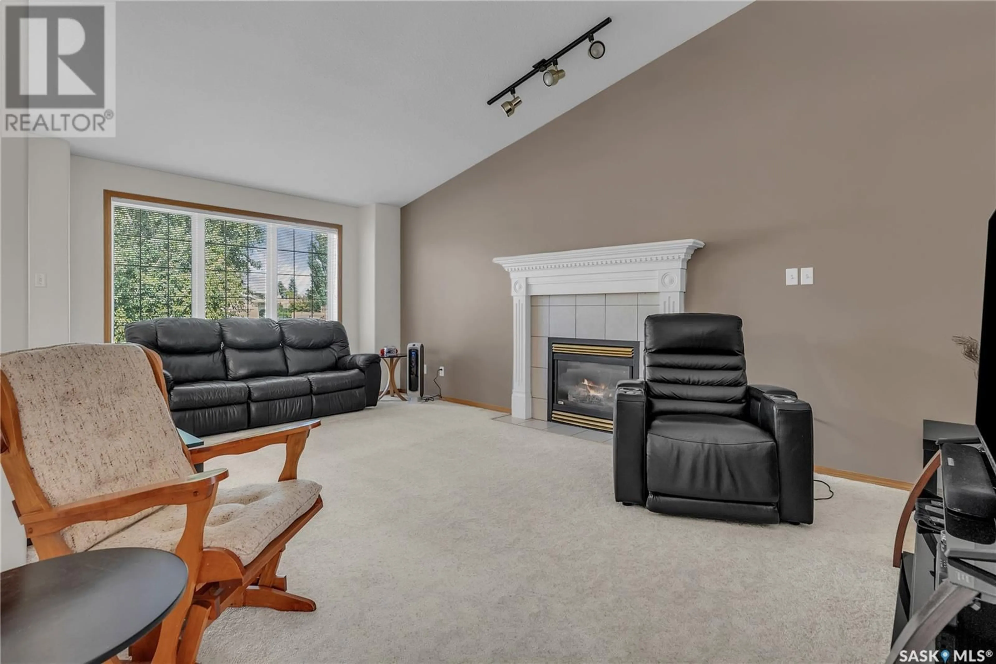 Living room with furniture, carpet floor for 423 CALDWELL PLACE, Saskatoon Saskatchewan S7M5S7
