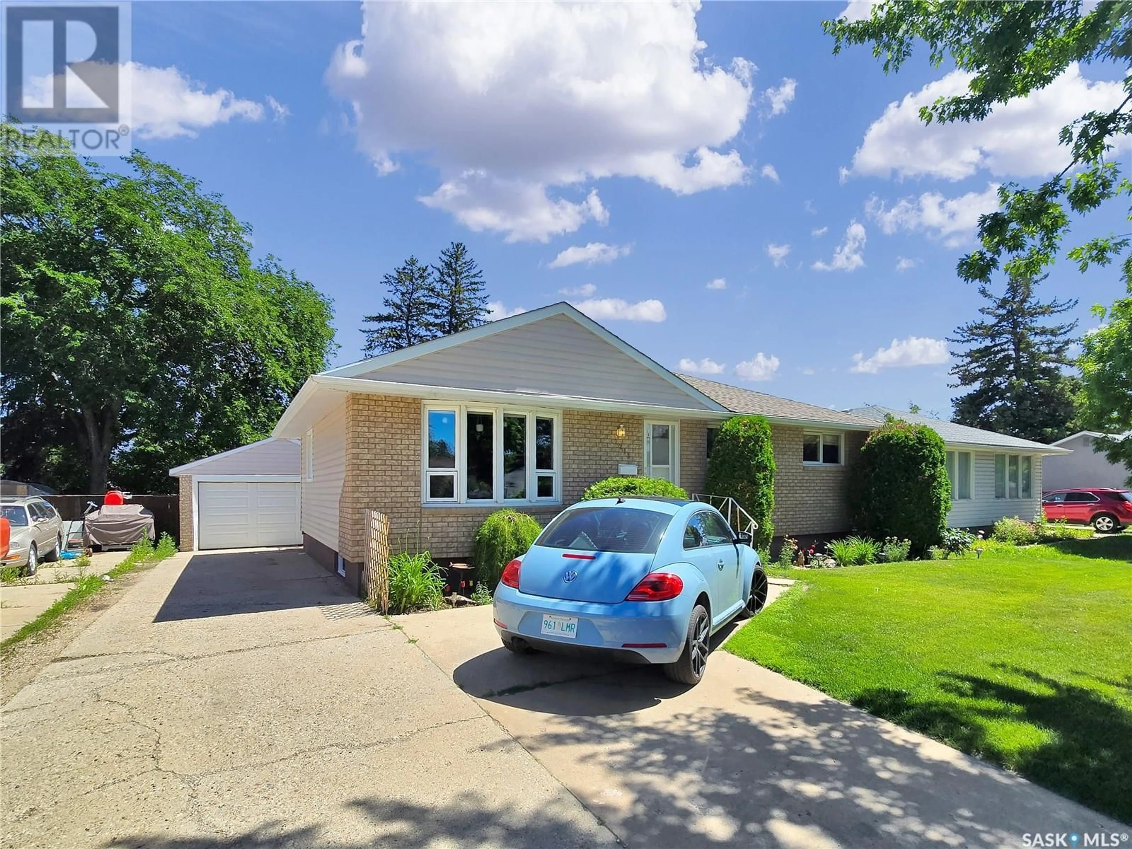 Home with vinyl exterior material, street for 2213 HAULTAIN AVENUE, Saskatoon Saskatchewan S7J1P7