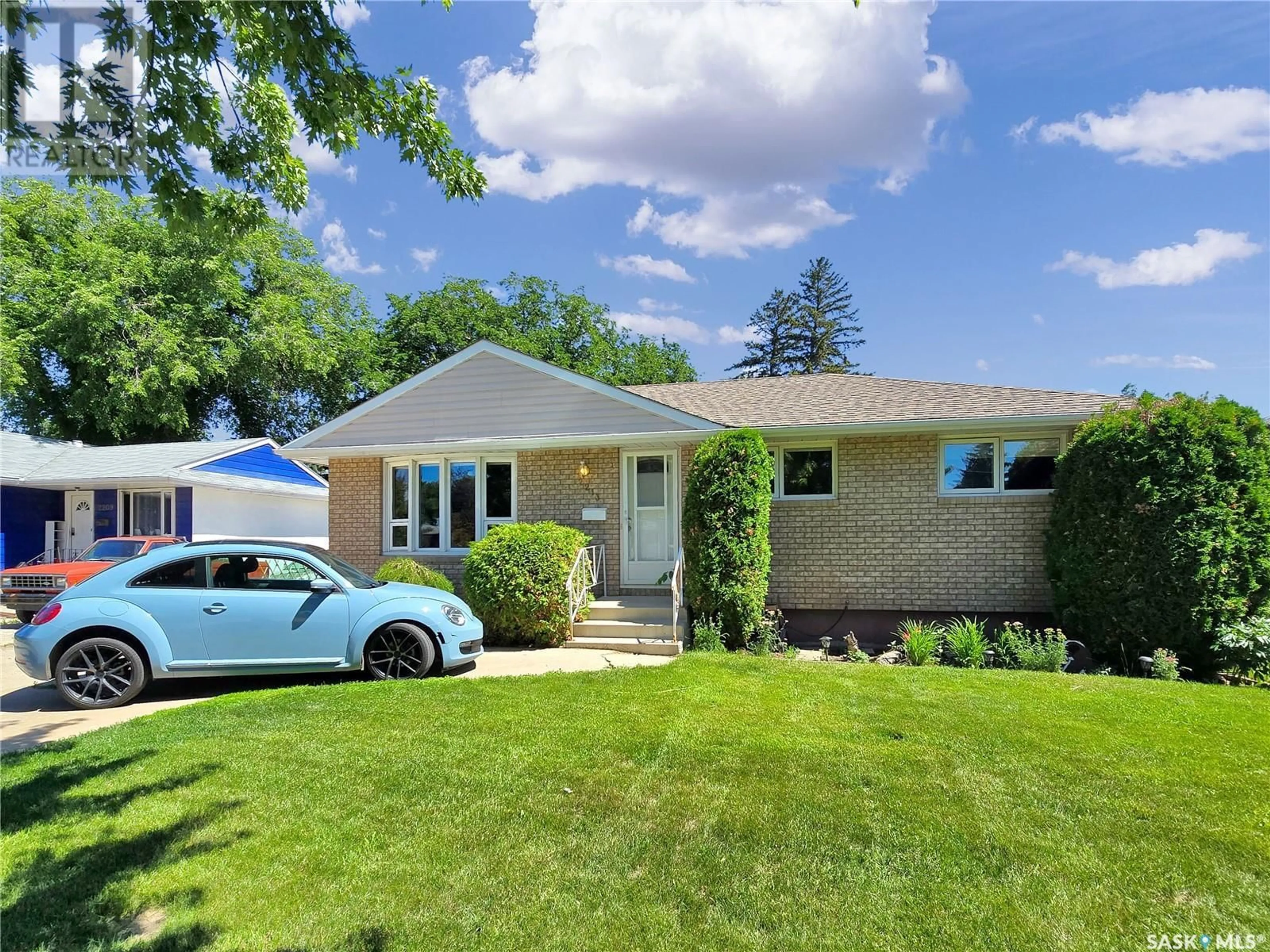 Home with vinyl exterior material, street for 2213 HAULTAIN AVENUE, Saskatoon Saskatchewan S7J1P7