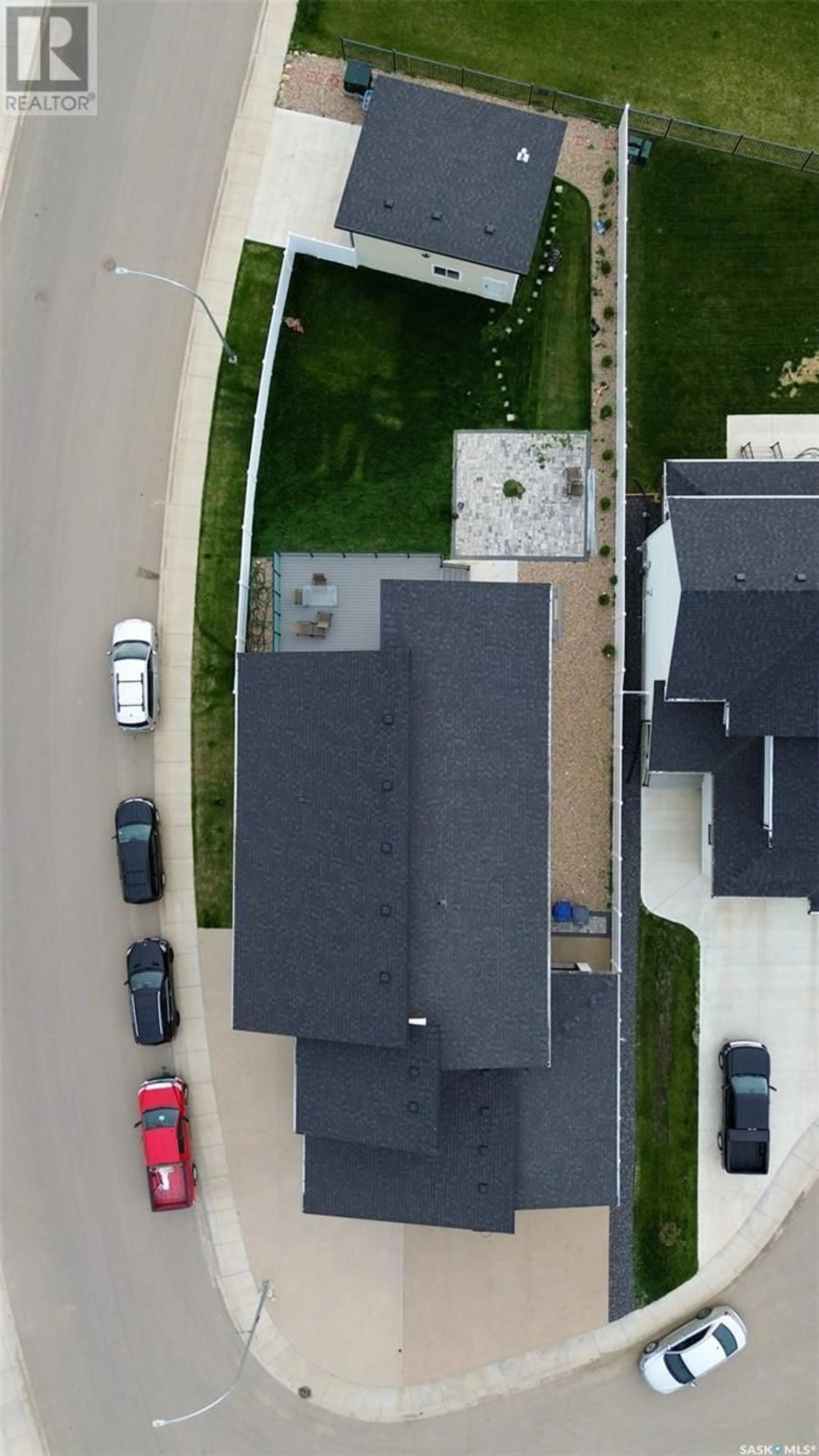 A pic from outside/outdoor area/front of a property/back of a property/a pic from drone, street for 303 WOOLF BAY, Saskatoon Saskatchewan S7W1E5