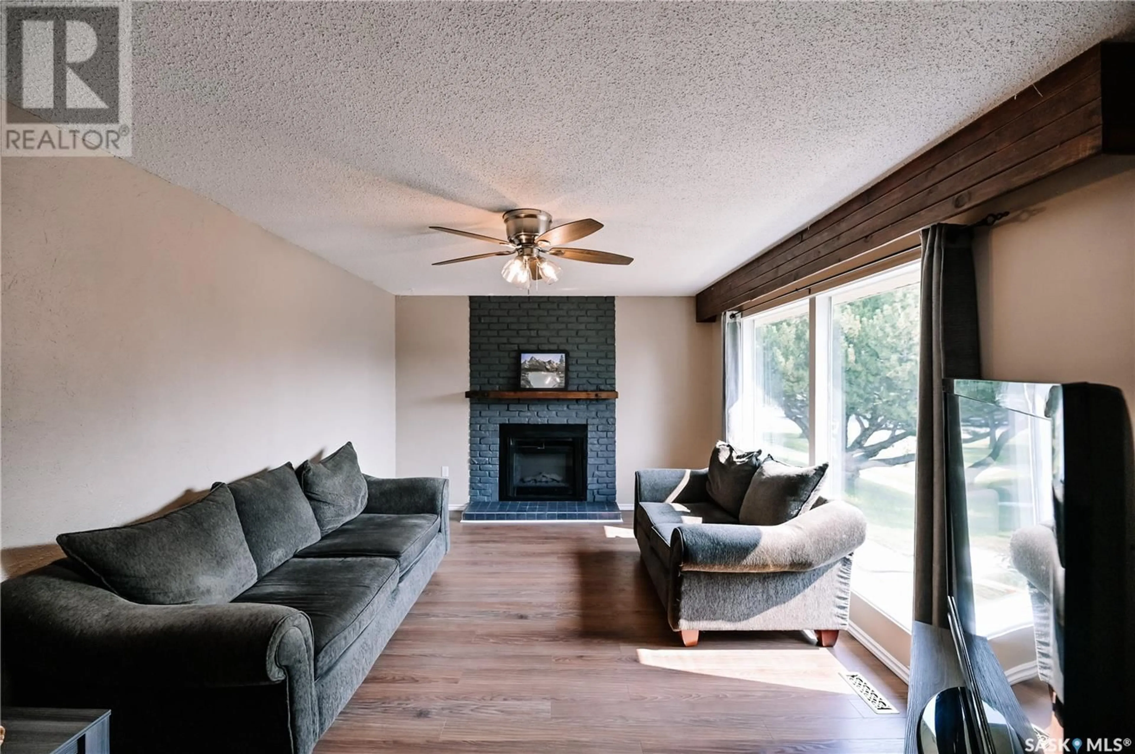 Living room with furniture, wood/laminate floor for 2605 15TH AVENUE, Prince Albert Saskatchewan S6V6H4