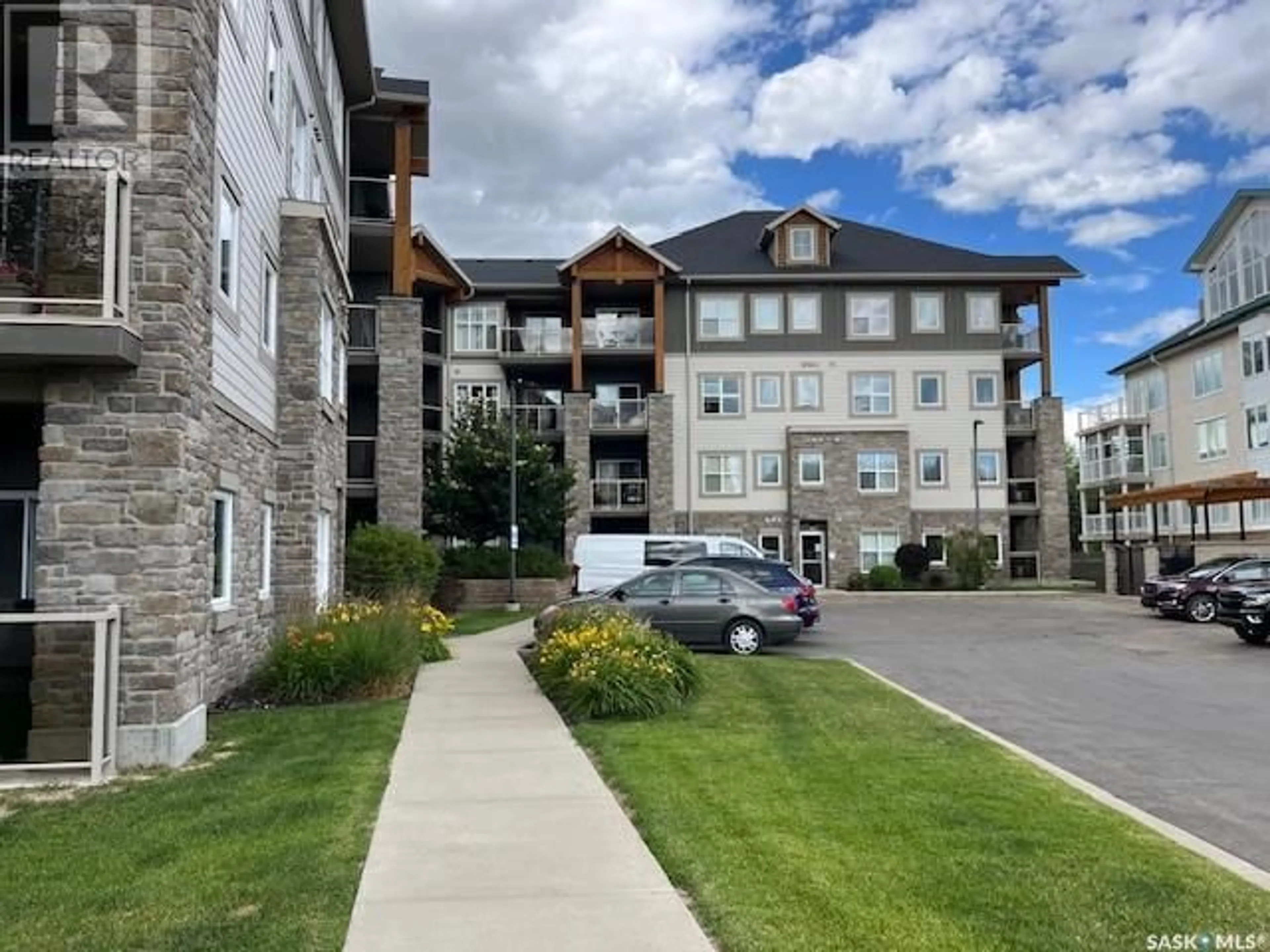 A pic from outside/outdoor area/front of a property/back of a property/a pic from drone, mountain view for 109 - 1220 BLACKFOOT DRIVE, Regina Saskatchewan S4S6T2