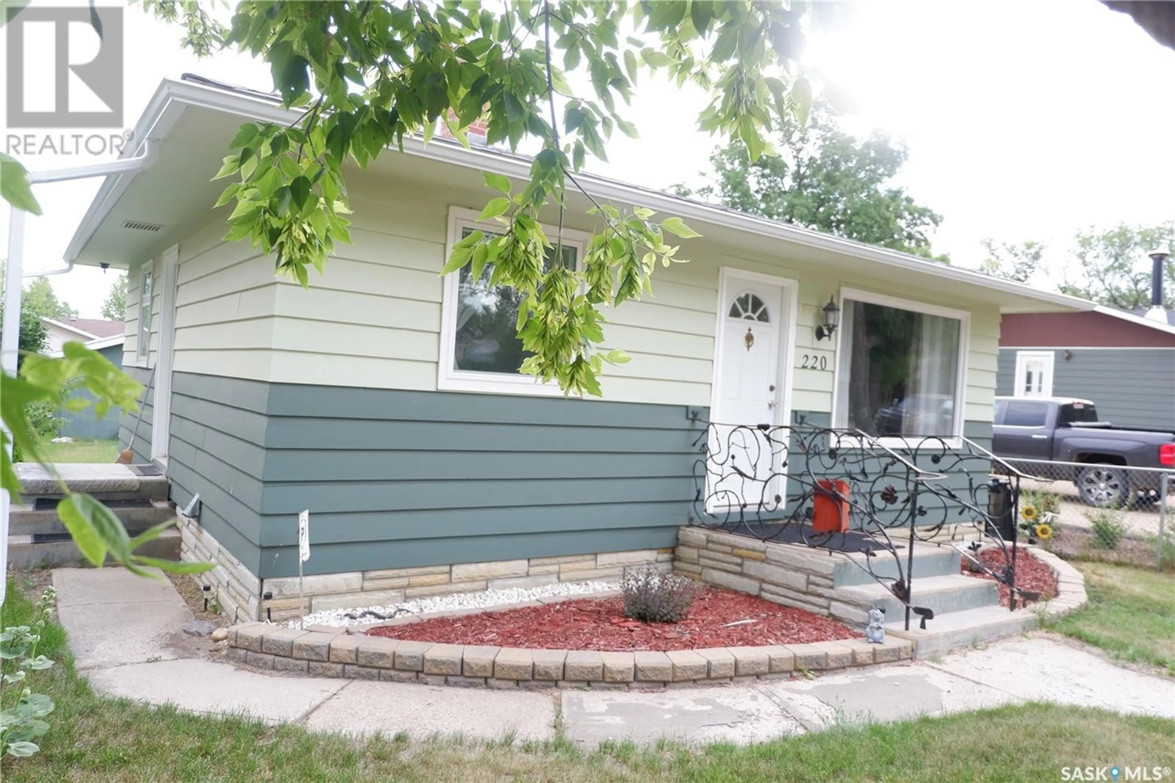 Home with vinyl exterior material, street for 220 6TH AVENUE, Assiniboia Saskatchewan S0H0B0