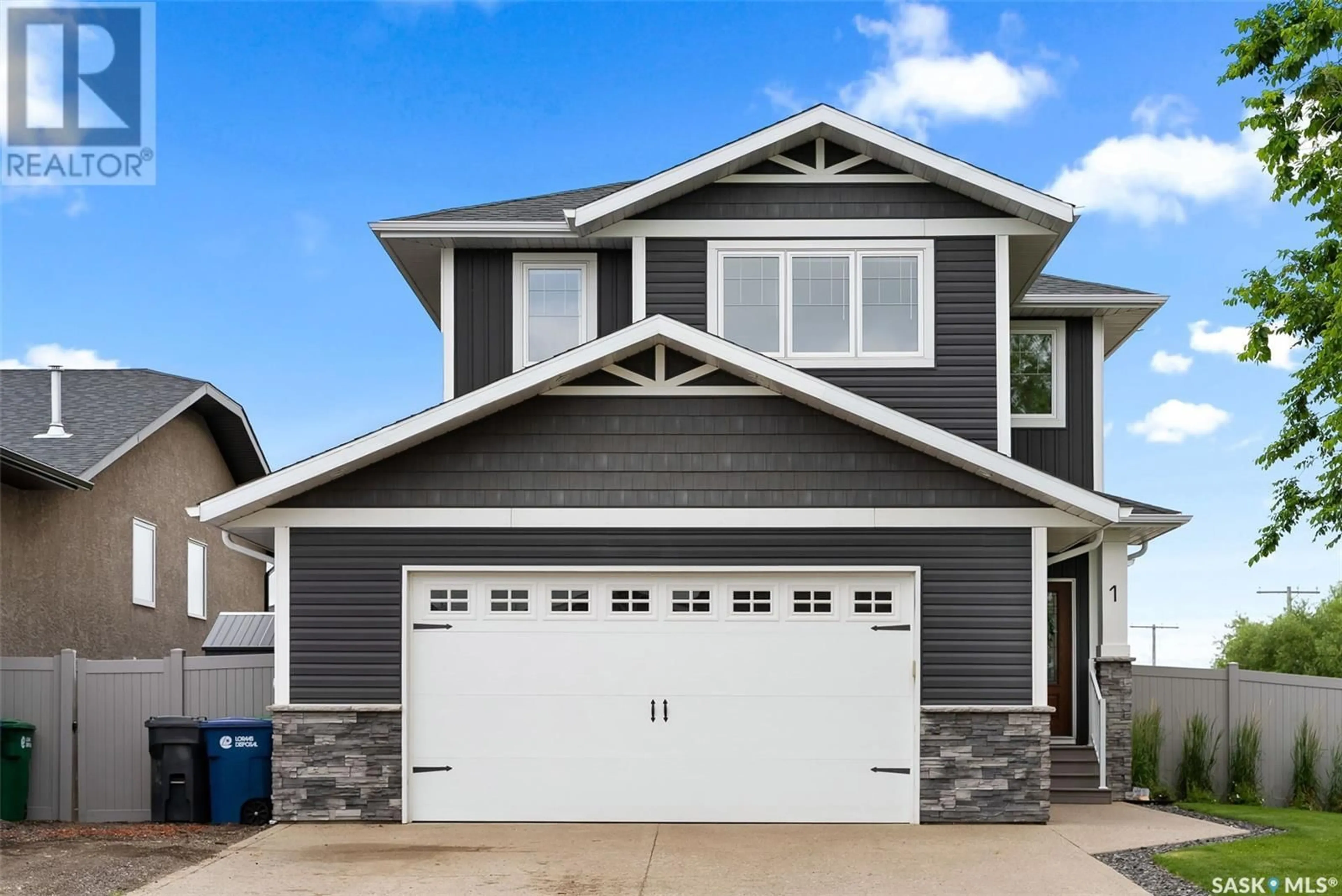 Home with vinyl exterior material, street for 1 MACKENZIE ROAD, Pilot Butte Saskatchewan S0G3Z0
