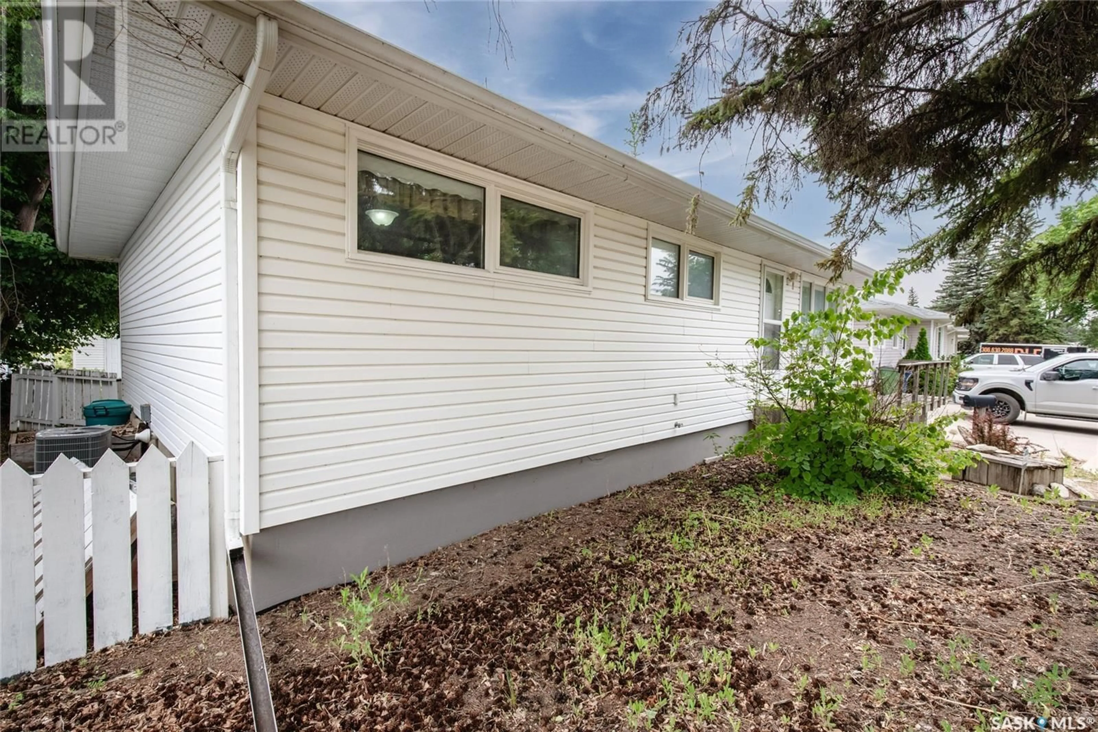 Home with vinyl exterior material, street for 1245 GRACE STREET, Moose Jaw Saskatchewan S6H3C6