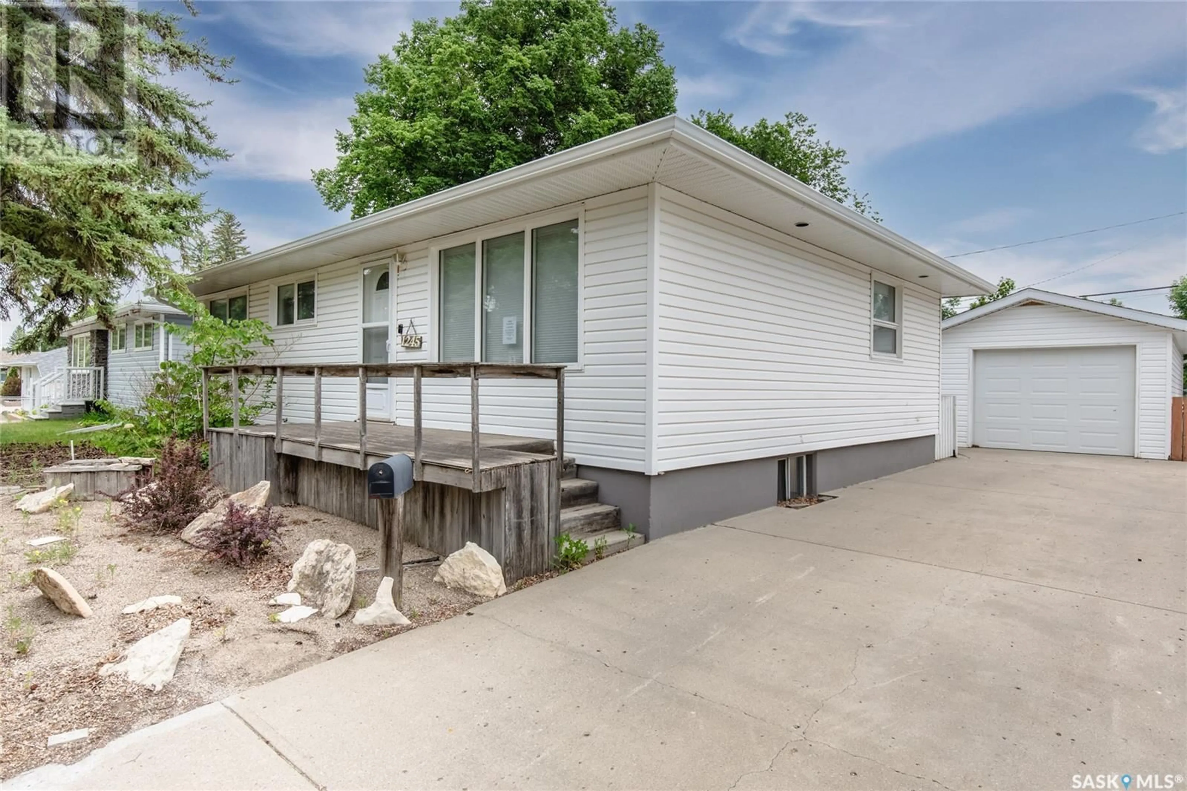 Home with vinyl exterior material, street for 1245 GRACE STREET, Moose Jaw Saskatchewan S6H3C6