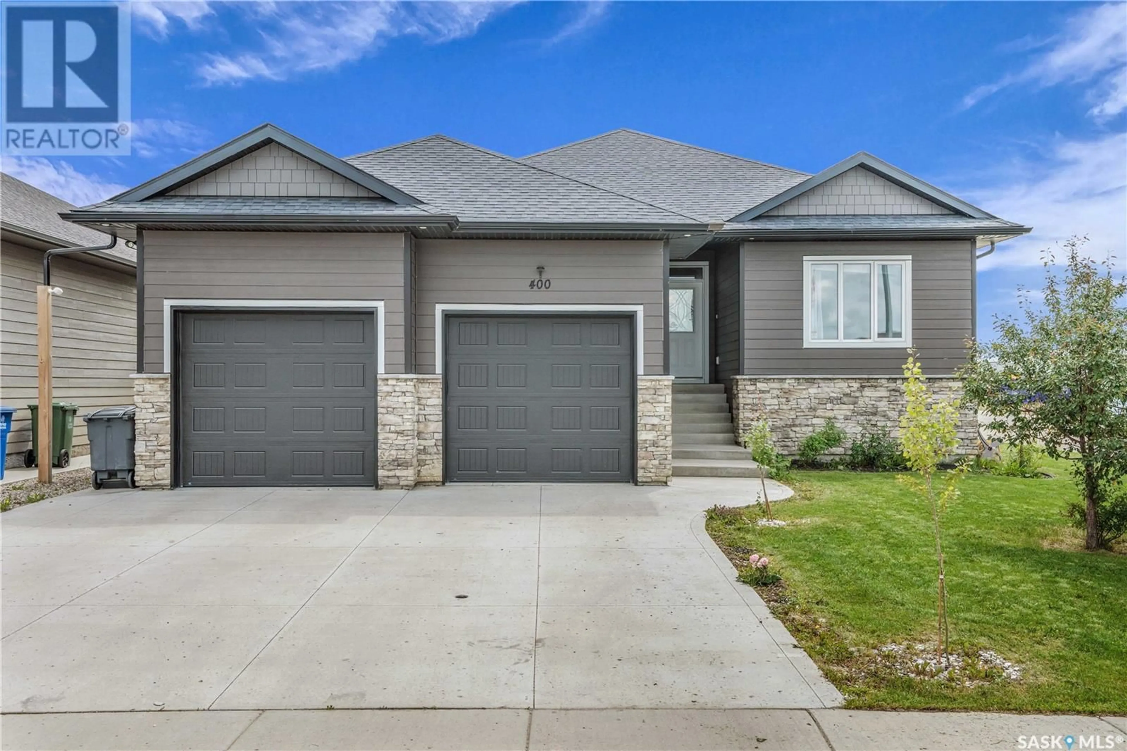 Home with brick exterior material, street for 400 PRAIRIE VIEW DRIVE, Dundurn Saskatchewan S0K1K1