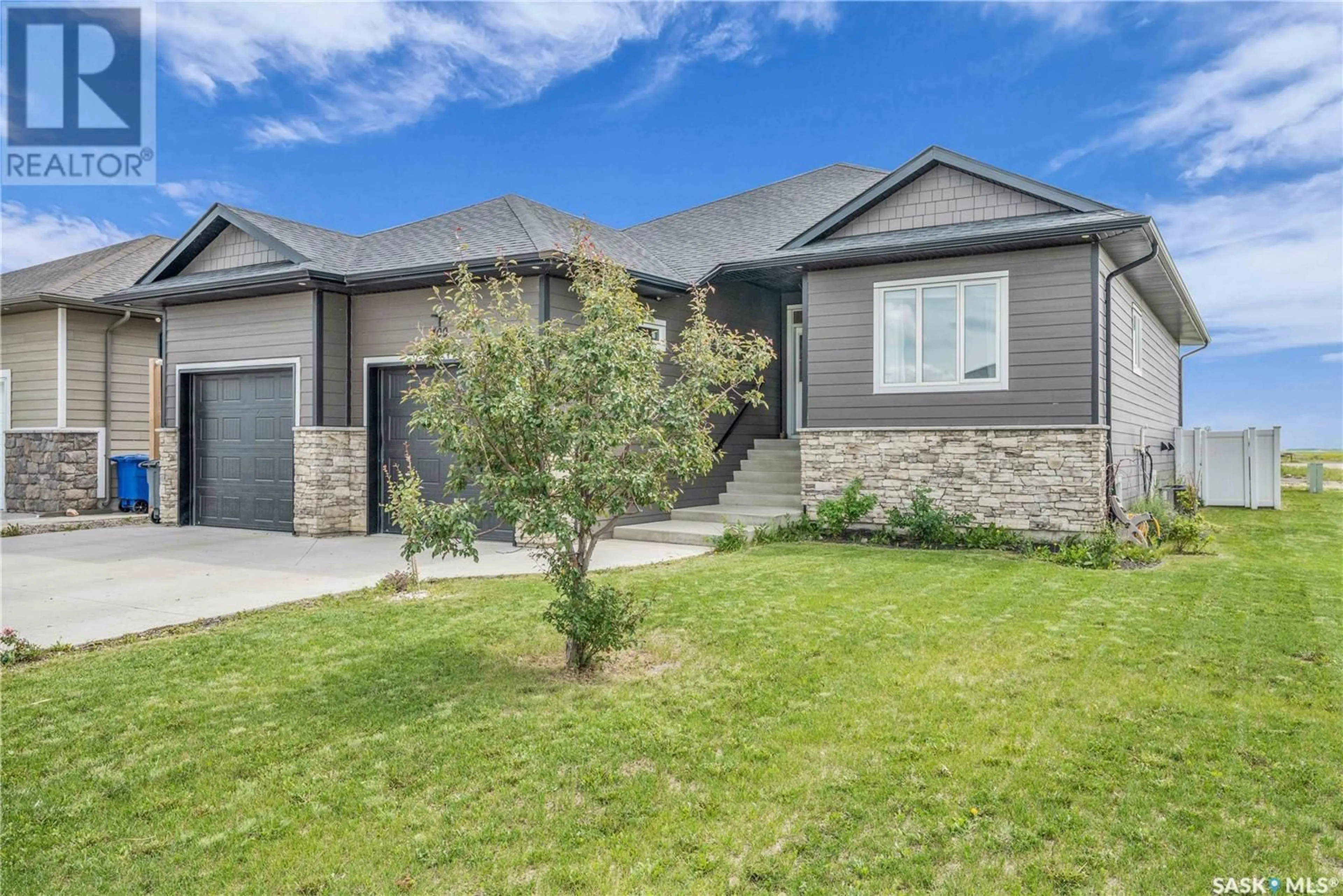 Home with brick exterior material, street for 400 PRAIRIE VIEW DRIVE, Dundurn Saskatchewan S0K1K1